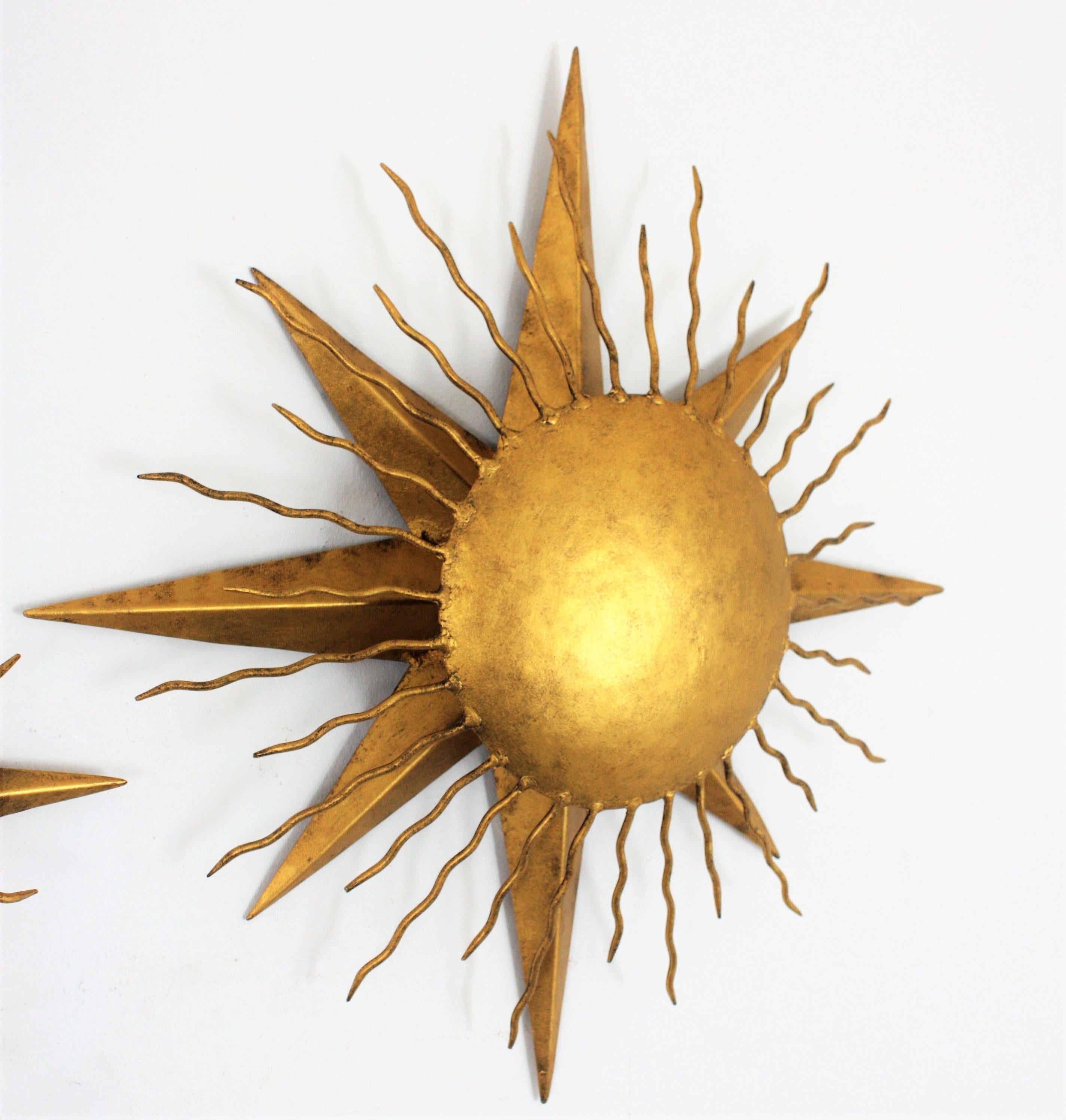 Gold Leaf Pair of Wrought Gilt Iron Starburst Sunburst Wall Light Fixtures, Spain 1950s
