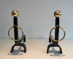 Pair of Wrought Iron and Brass Andirons in the style of Jacques Adnet