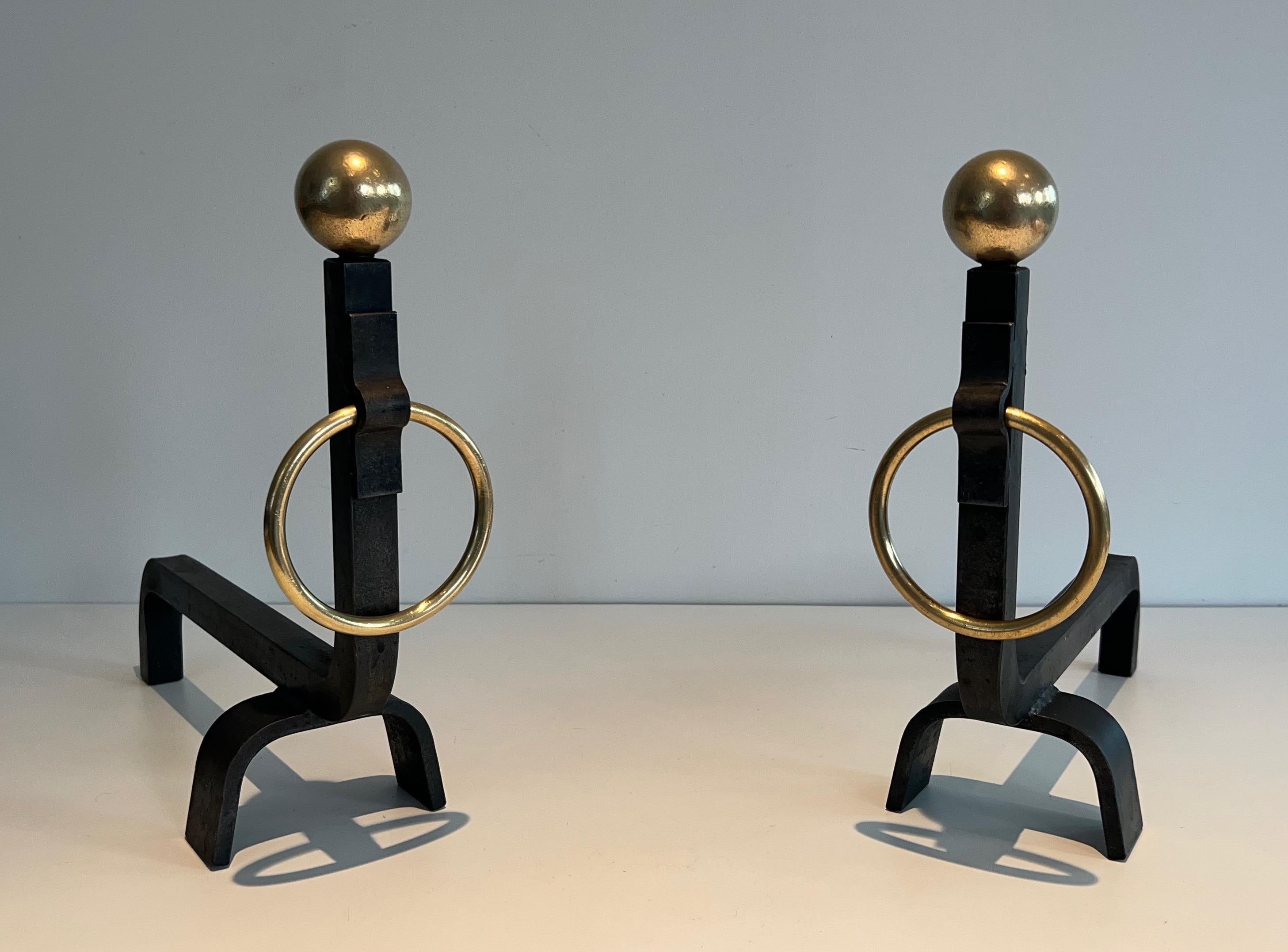 Mid-Century Modern Pair of Wrought Iron and Brass Andirons in the style of Jacques Adnet For Sale
