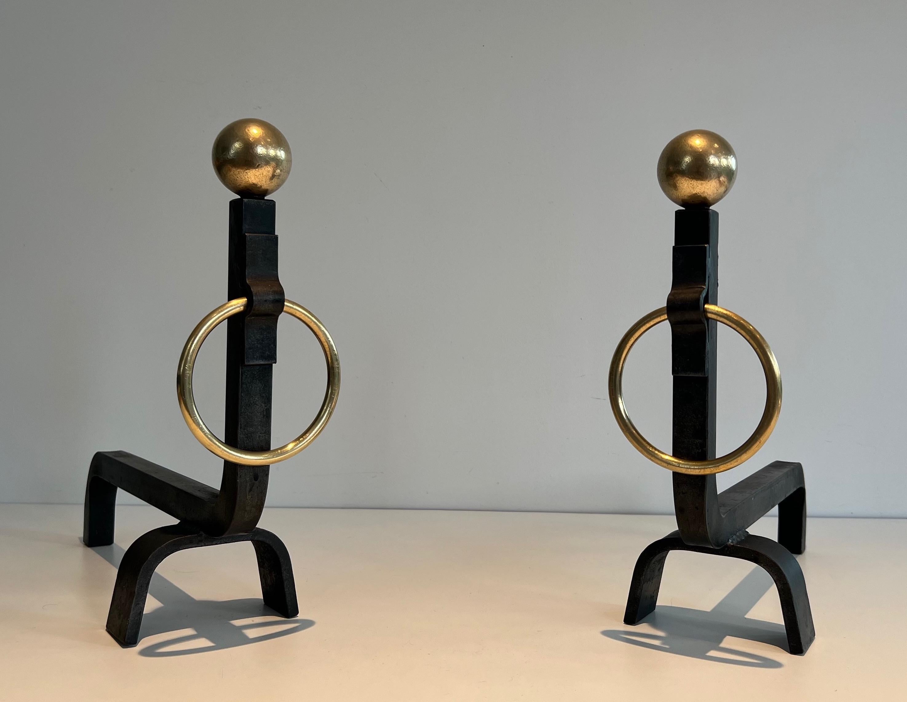 French Pair of Wrought Iron and Brass Andirons in the style of Jacques Adnet For Sale