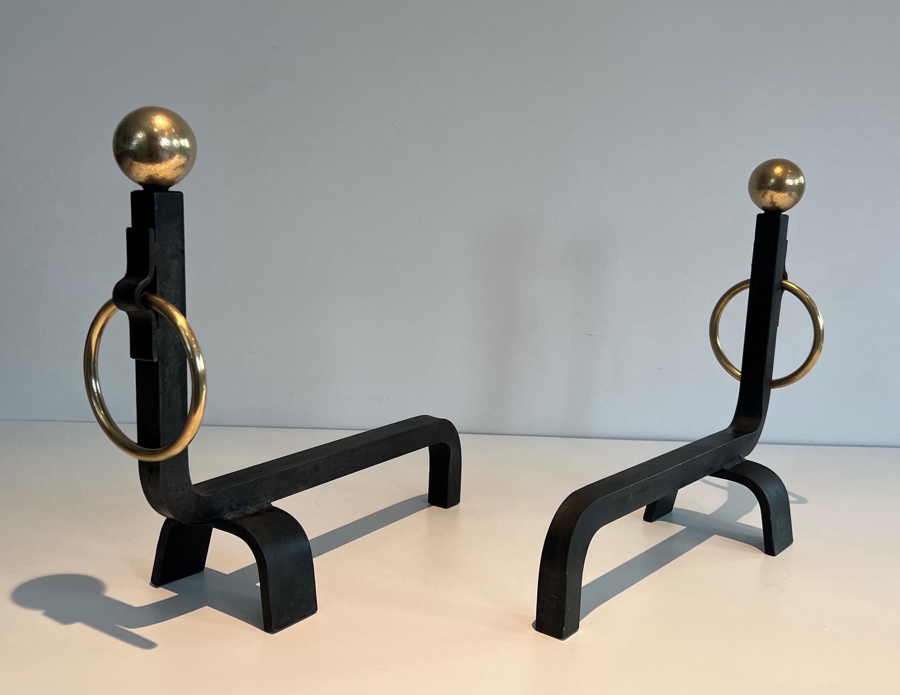 Mid-20th Century Pair of Wrought Iron and Brass Andirons in the style of Jacques Adnet For Sale