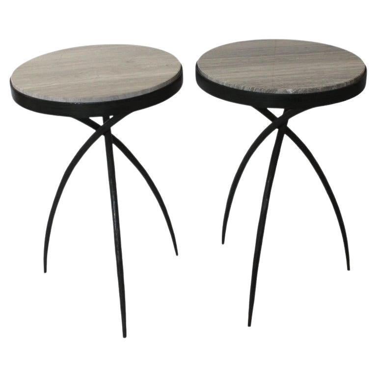 This stylish set of side tables will make a statement with their form and use of materials. The legs are reminiscent of the elongated trunks of the mangrove trees of Florida. 

Note: The two table tops are not identical in their coloration (see