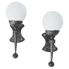 Pair of wrought iron and opaline wall sconces, 1950s