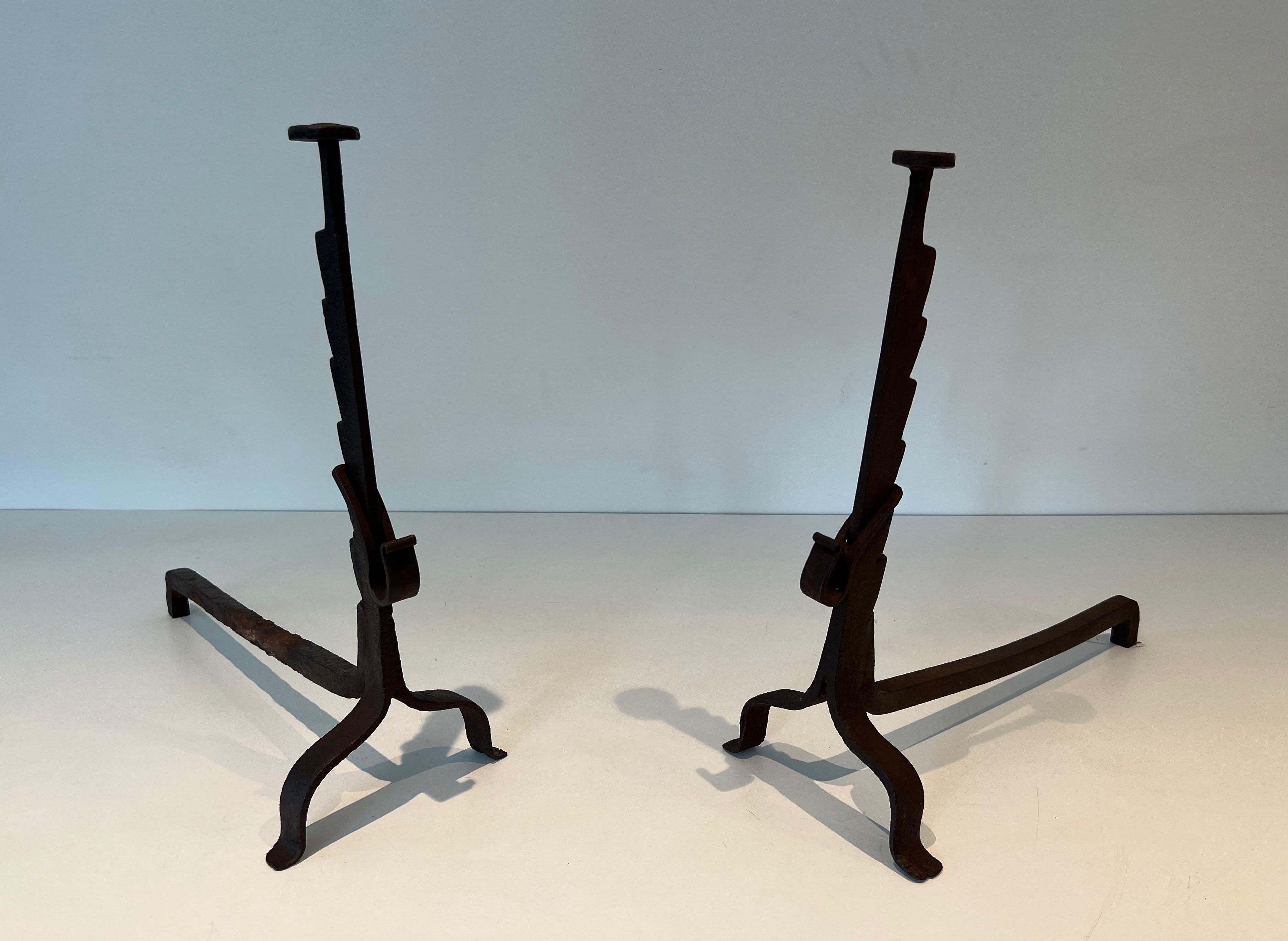 This pair of andirons is made of wrought iron with rack. This is a French work. Circa 1900