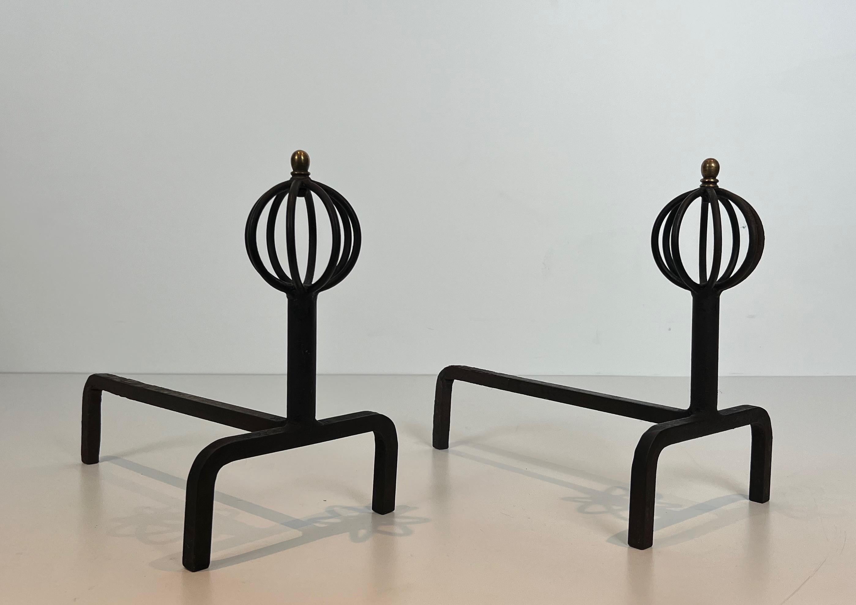 This pair of andirons is made of wrought iron. This is a French work. Circa 1940