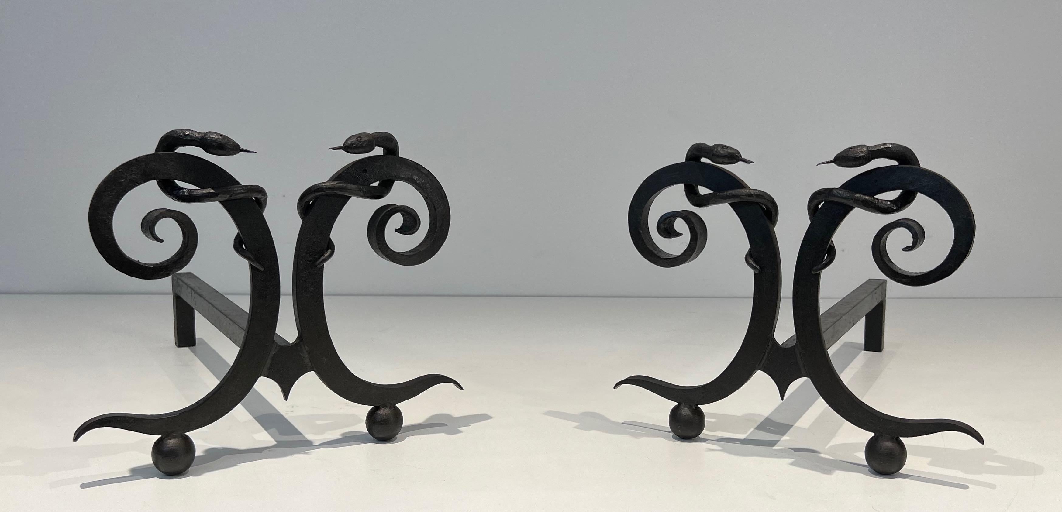 This pair of very nice and ineteresting andirons are made of wrought iron. This is the 