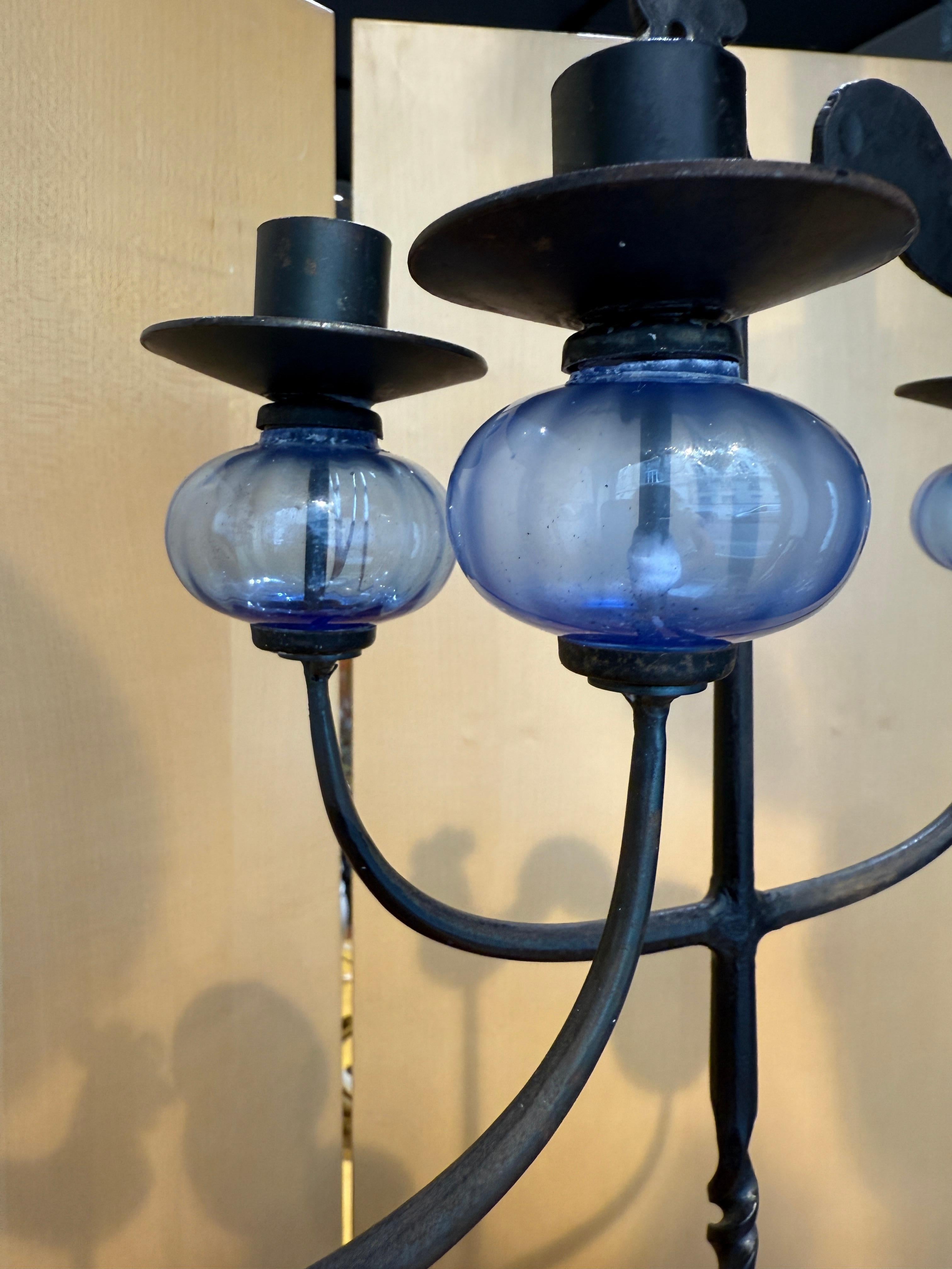 Elegant pair of wrought iron candelholders with glass décoration 
By Bertil Vallien Sweden 1970
Nice vintage condition 