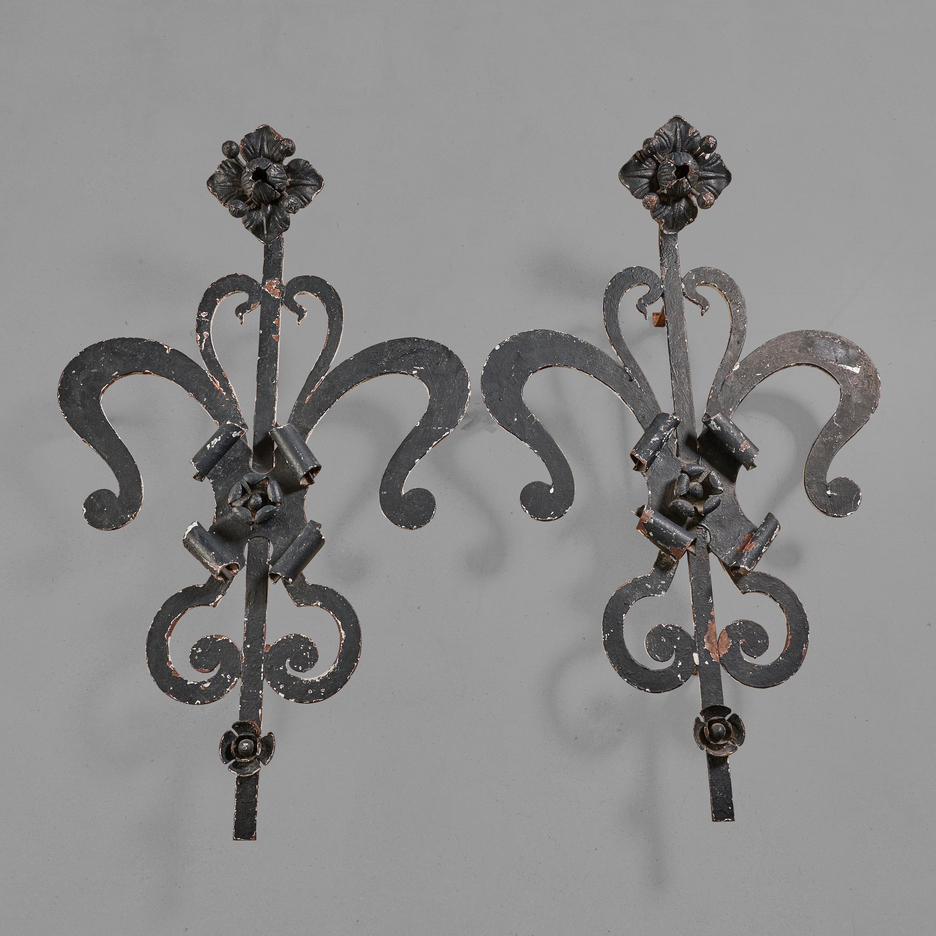 Wrought iron decorative facade ornaments with a floral theme. 

 