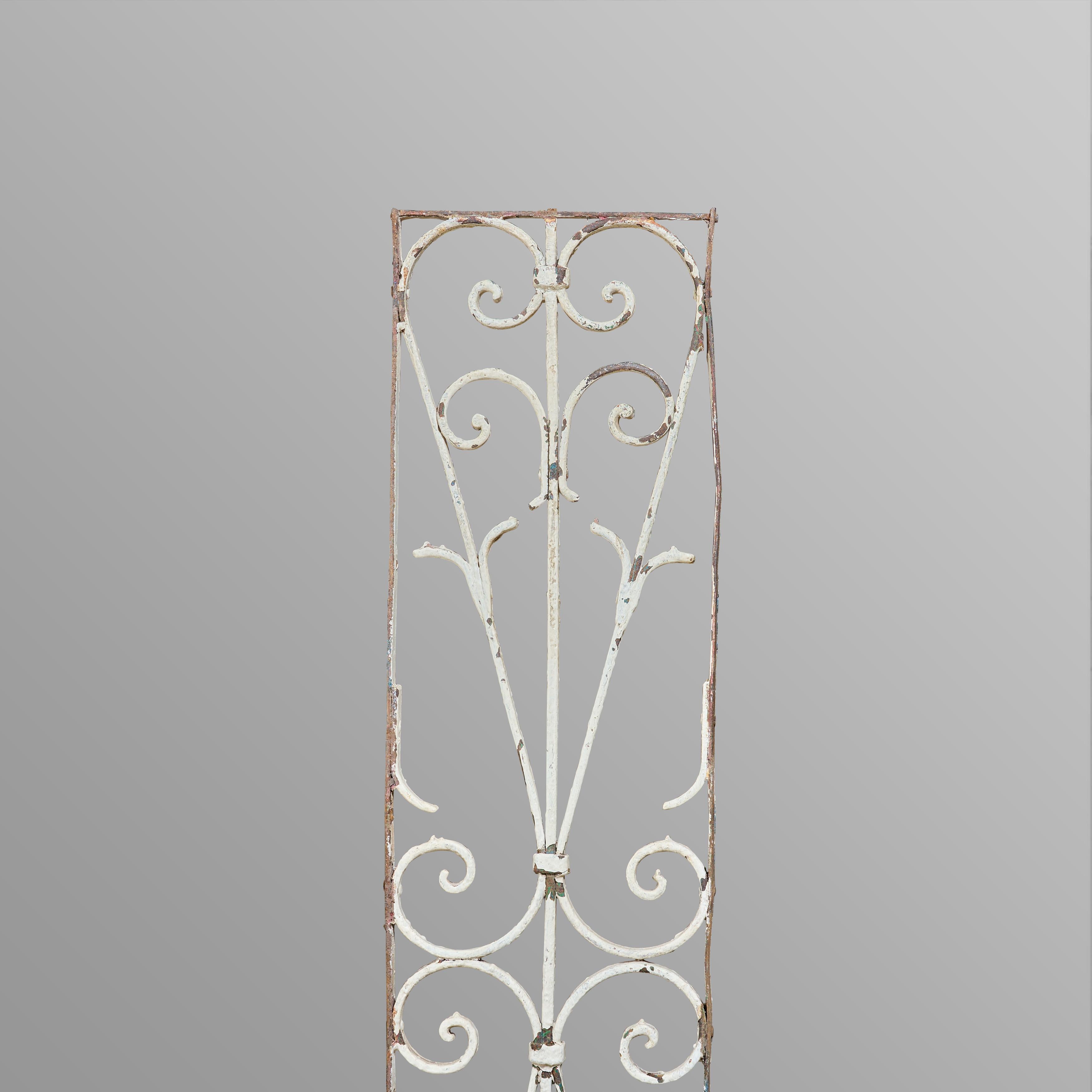 Pair of wrought iron decorative panels with original paint.