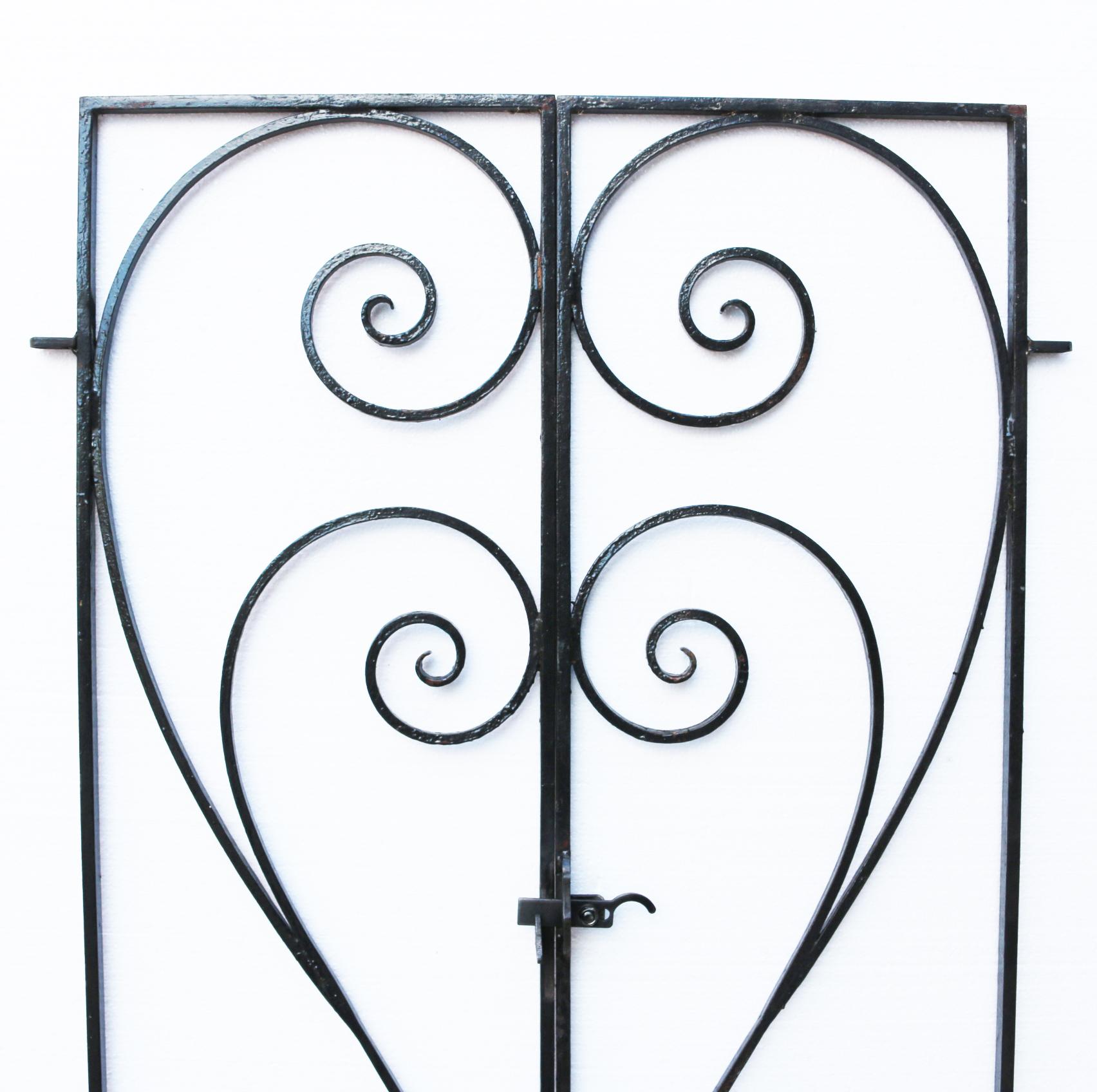 About:

A pair of good quality wrought iron gates with flowing scroll design. Reclaimed from a property in Surrey.

Condition report:

In good condition for their age and use, finished in old black paint. Replacement hinges and latch fitted.