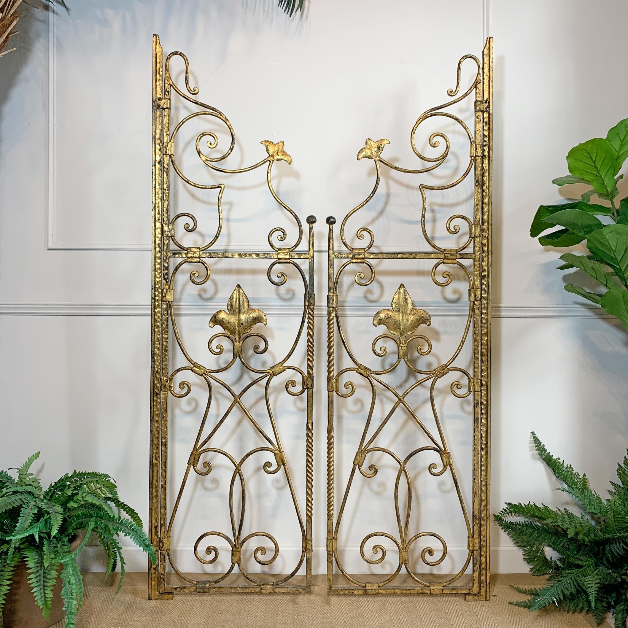A glorious pair of large, hand forged wrought iron Church Altar Gates, Spain circa 1900. These gates would have stood at the entrance to the altar in a church, probably from Northern Spain, they are presented in their original gilt, and supplied