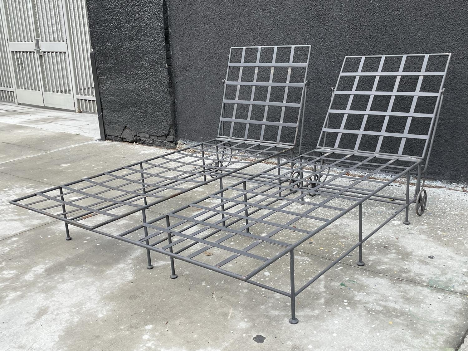 Pair of Wrought Iron Lounge Chairs with Wheels in the Style of Mario Papperzini. These stunning chairs are perfect for any outdoor space, offering both comfort and style. Made with high-quality wrought iron, the metal frame ensures durability and