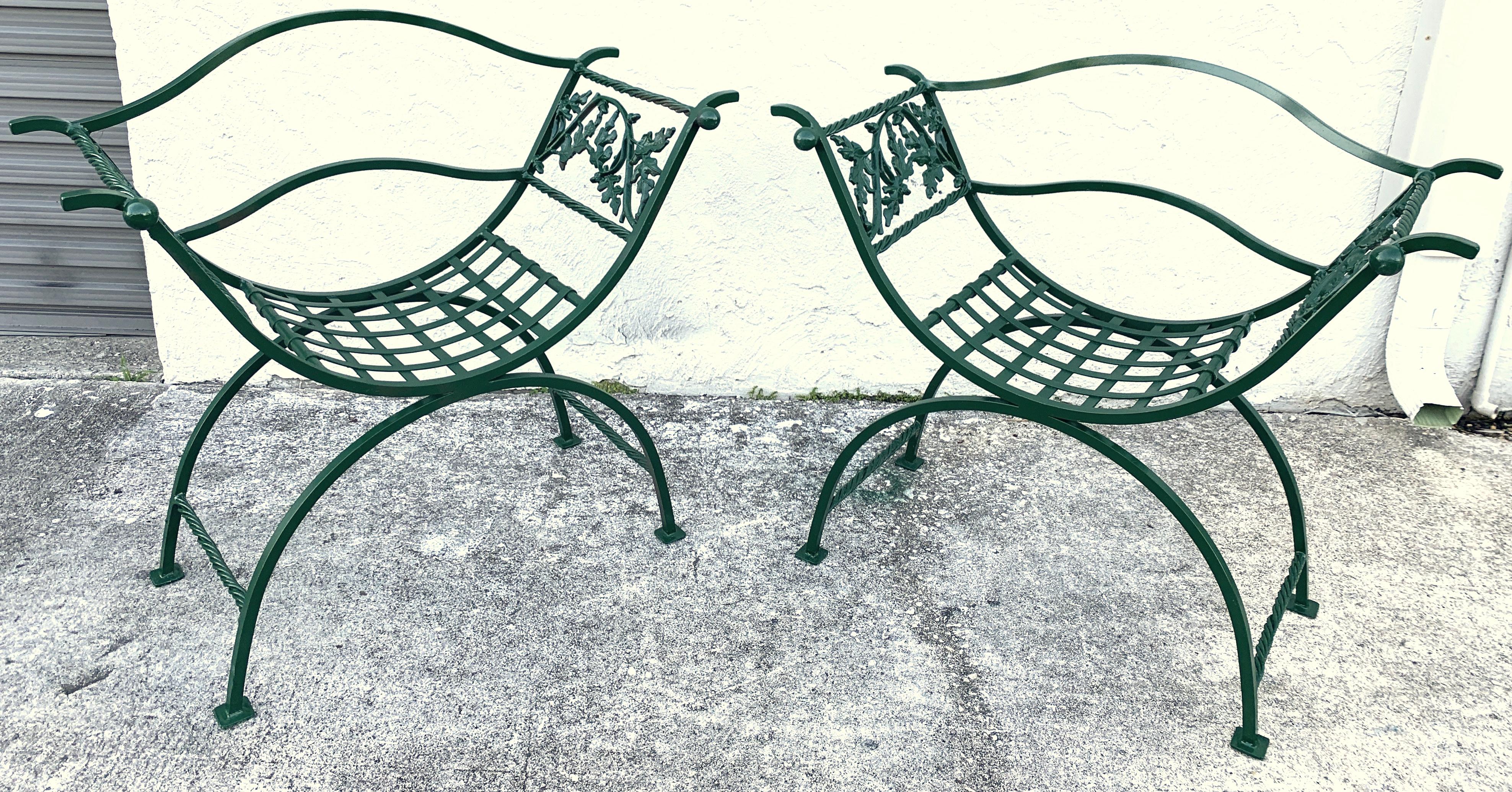 Pair of wrought iron oak leaf motif Curule benches, provenance Celine Dion
Each one of substantial size and weight, with pierced back rest and woven seats
Each bench measures 42