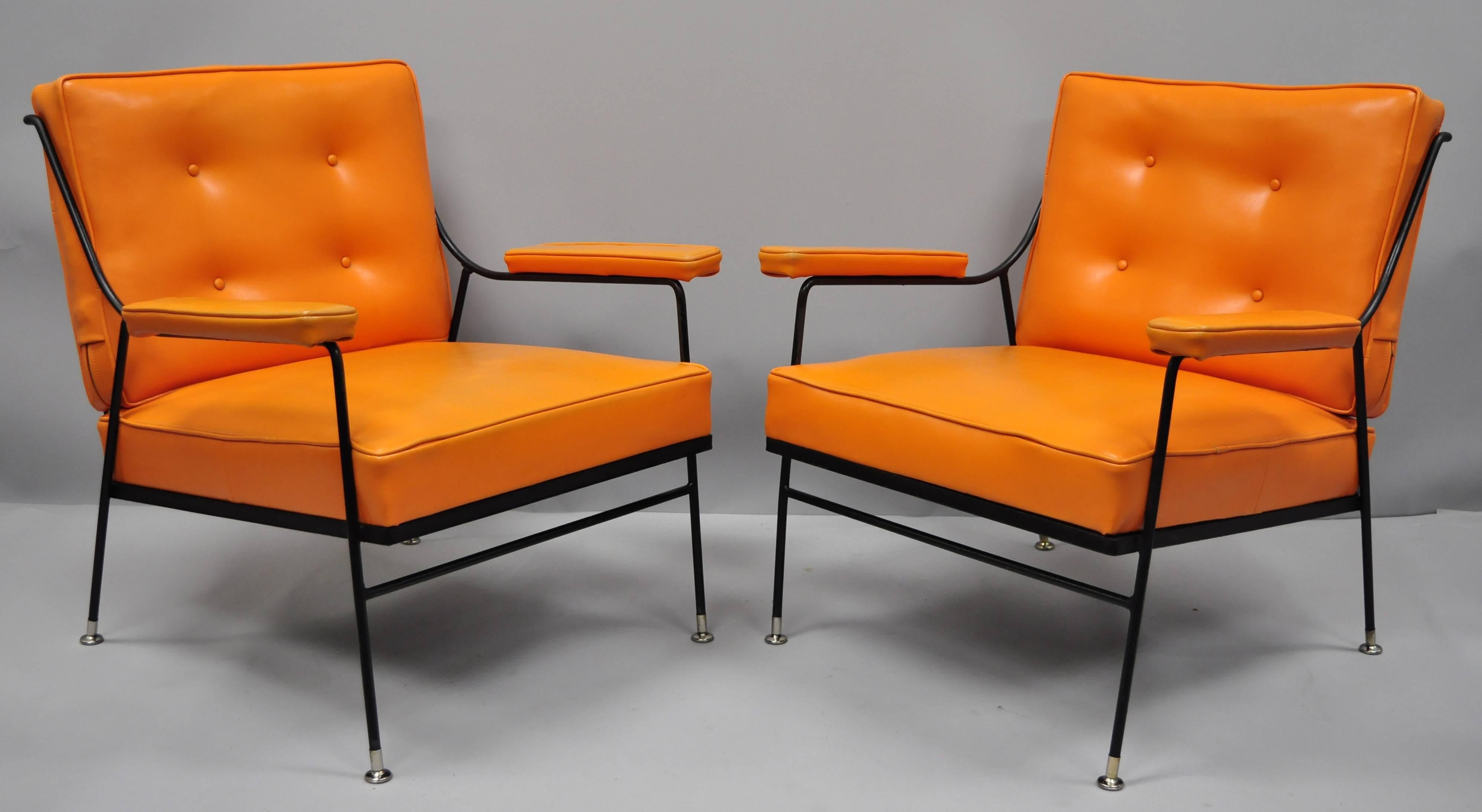 Rare Pair of Mid Century Modern Wrought Iron & Orange Naugahyde Lounge Chairs attributed to Milo Baughman for Pacific Iron Products. Item features button tufted orange vinyl cushions, loose back cushion, wrought iron construction, upholstered