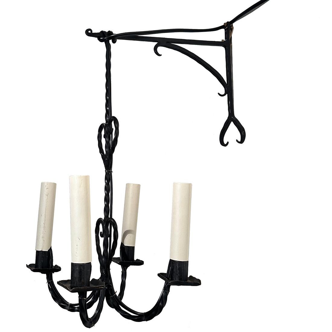 Pair of 1950's Italian wrought iron sconces with 4 lights.

Measurements:
Height: 16.5
