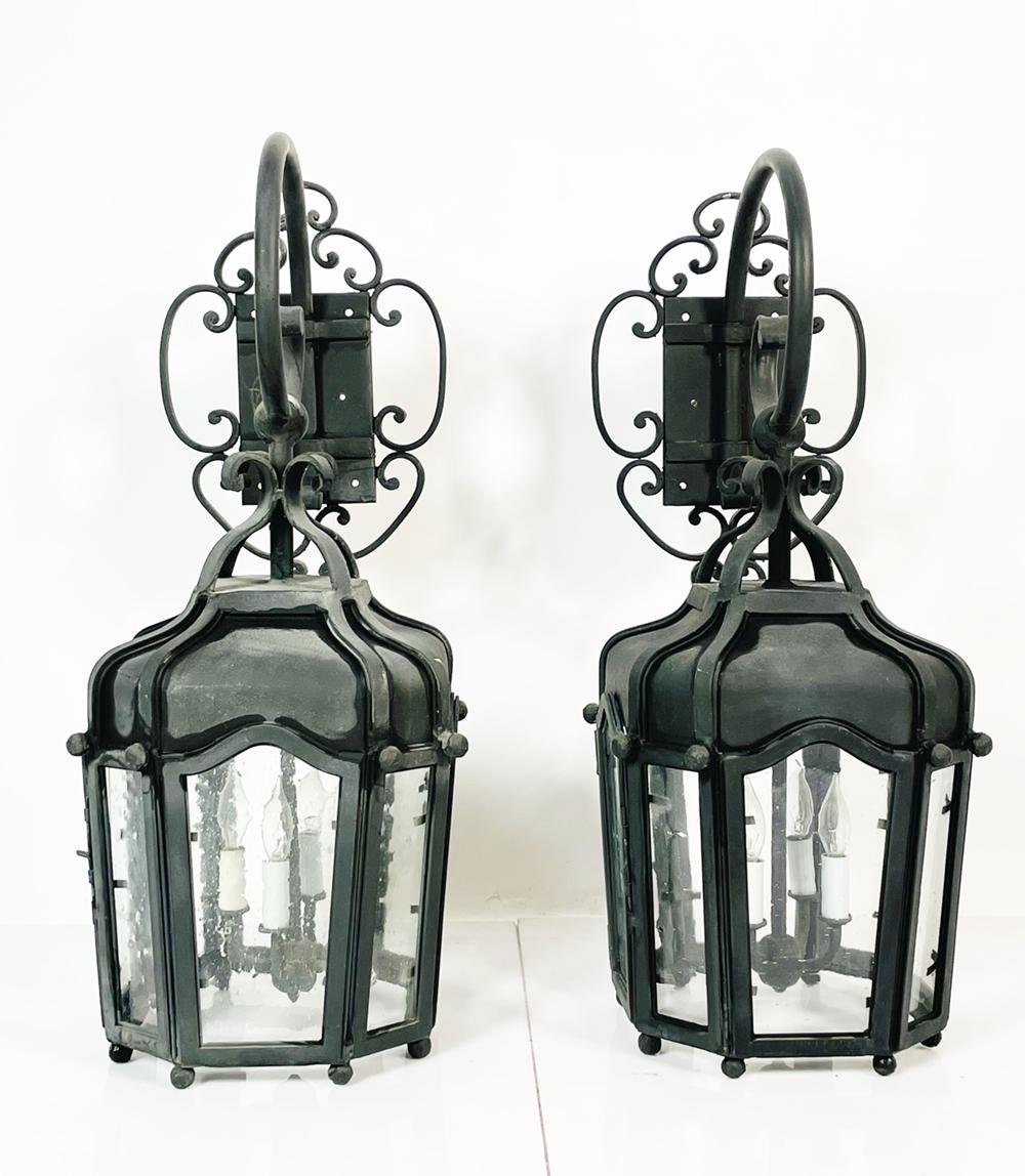 Introducing a rare and exquisite addition to your home decor - a pair of wrought iron sconces from the Beverly Park home of none other than Sylvester Stallone himself! These stunning wall lamps are made of high-quality black iron, and are designed
