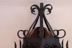 Pair of wrought iron sconces with hands blown glass