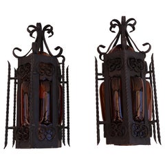 Pair of wrought iron sconces with hands blown glass