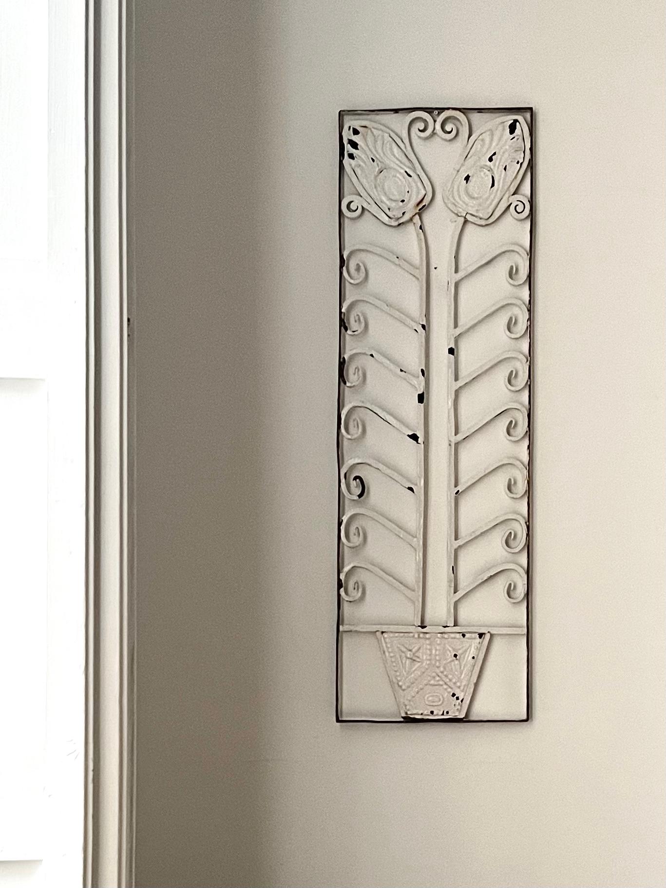 A set of two very attractive wrought iron screens depicting flowers and stylised leaves. European, early years of the twentieth century, possibly German or Czech in art nouveau or early art deco style. 

These pieces are wrought iron, in fair