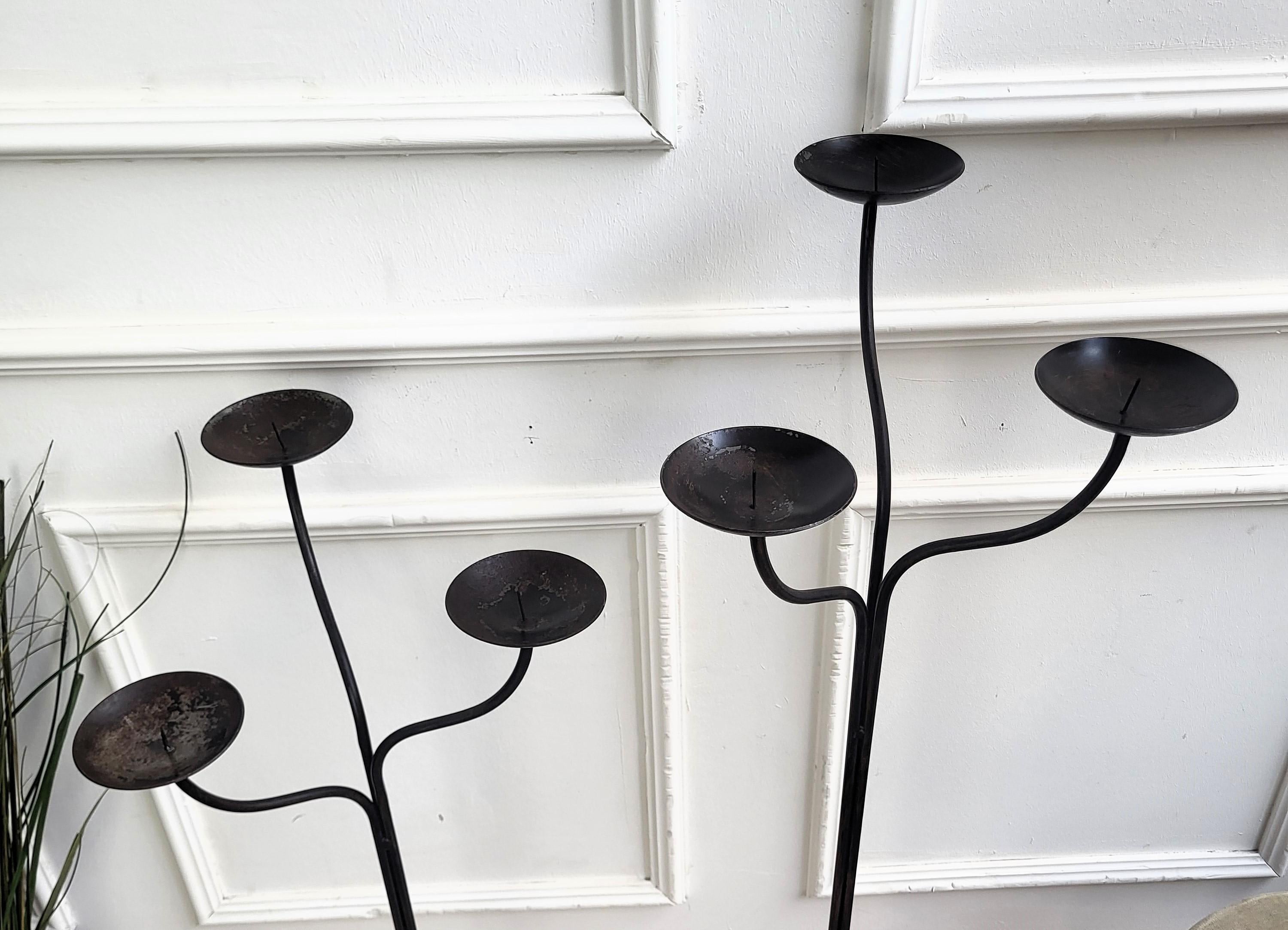 Pair of wrought iron tall floor candle holders in brutalist style