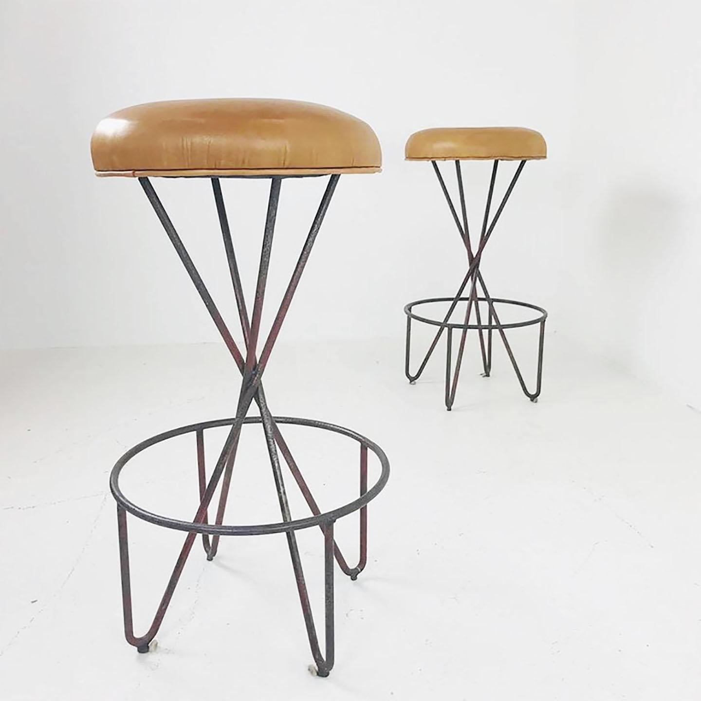 Pair of wrought iron Weinberg barstools. Stools are in good vintage condition with wear due to age and use.

Dimensions:
17” diameter x 32” tall.