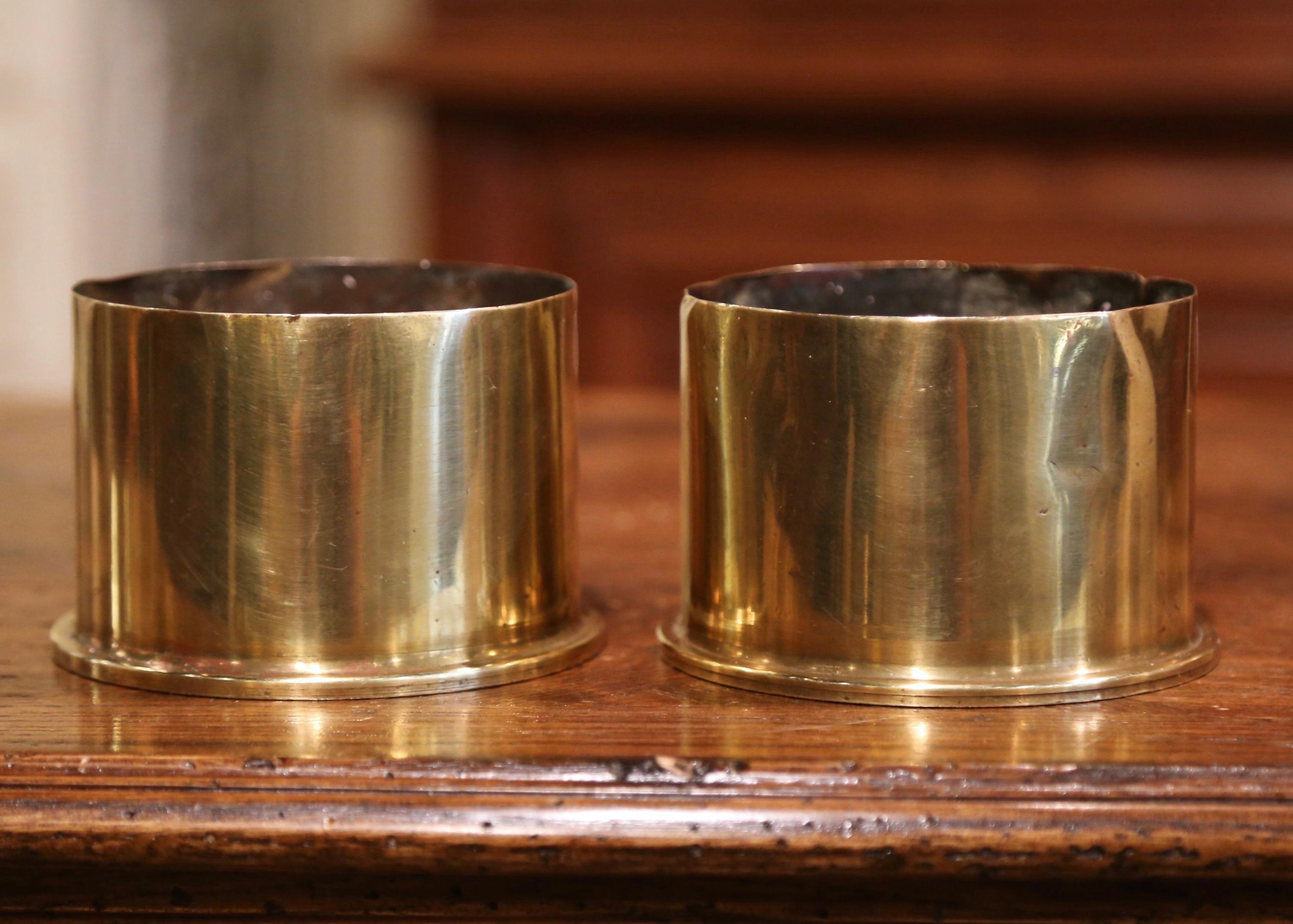 Take a piece of history into your home with these authentic English bombshells from the First World War (WWI 1914-1918). Made of brass, the impressive pieces of artillery are round in shape and dated on the bottom 1917. These one of a kind