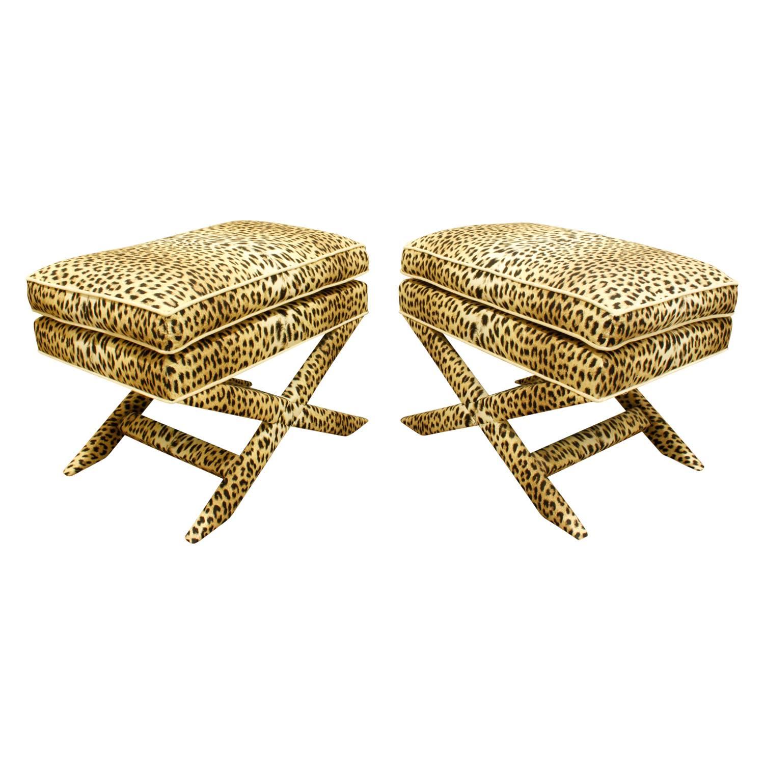 Pair of X-benches newly upholstered in a leopard print fabric, American, 1970s.