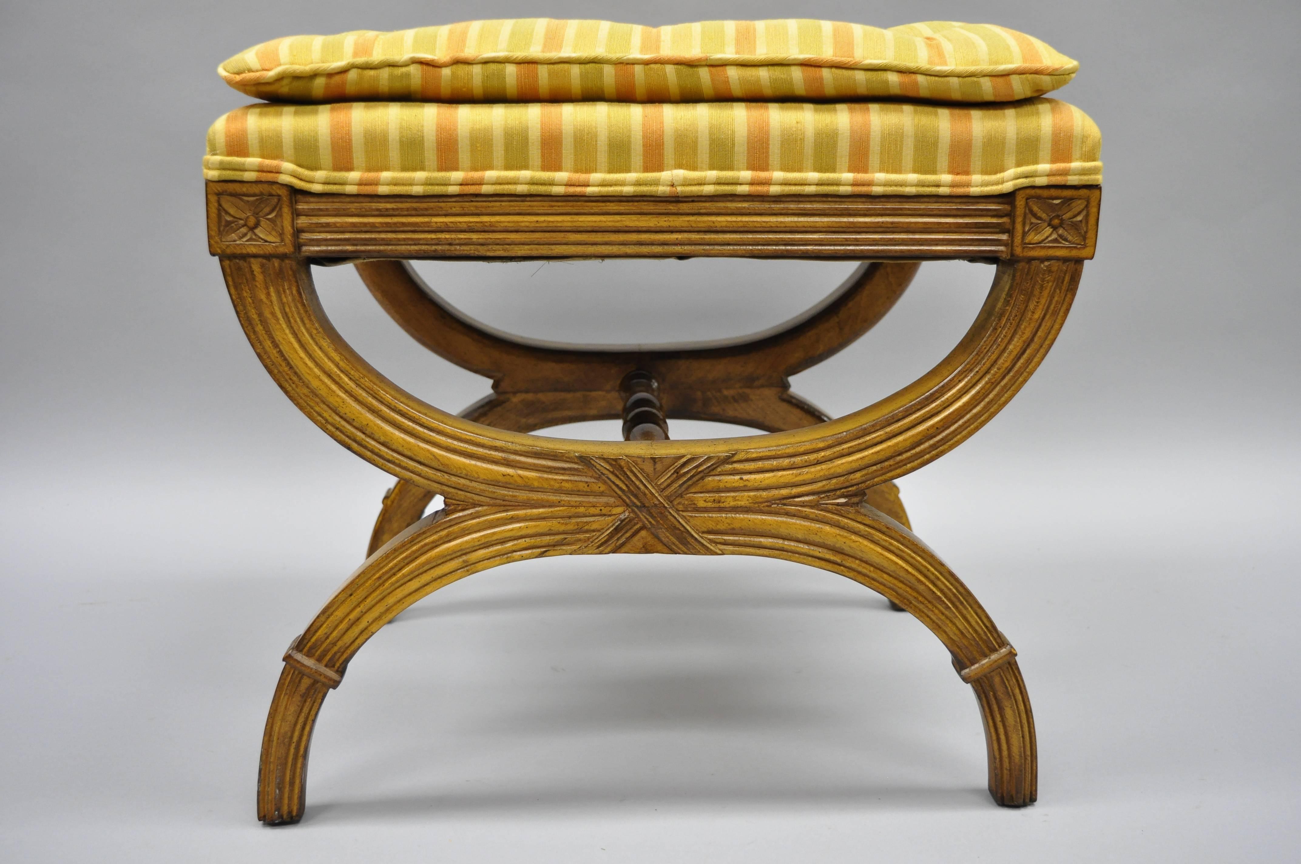 Pair of X-frame French Neoclassical style stools / benches with gold upholstery attributed to Karges. Item features gold and orange button tufted pillow top seats, solid wood construction, beautiful wood grain, nicely carved details, with great