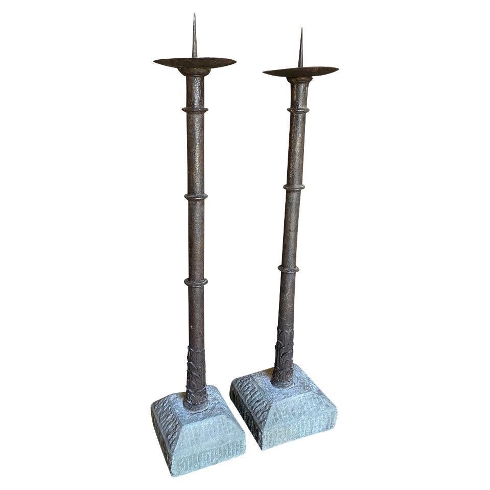 A stunning pair of XIV - XV century Romanesque Torcheres from northern Italy.  Wonderfully crafted from iron and resting in sandstone bases.  Excellent craftsmanship and excellent quality.  One piece measures 60 3/4