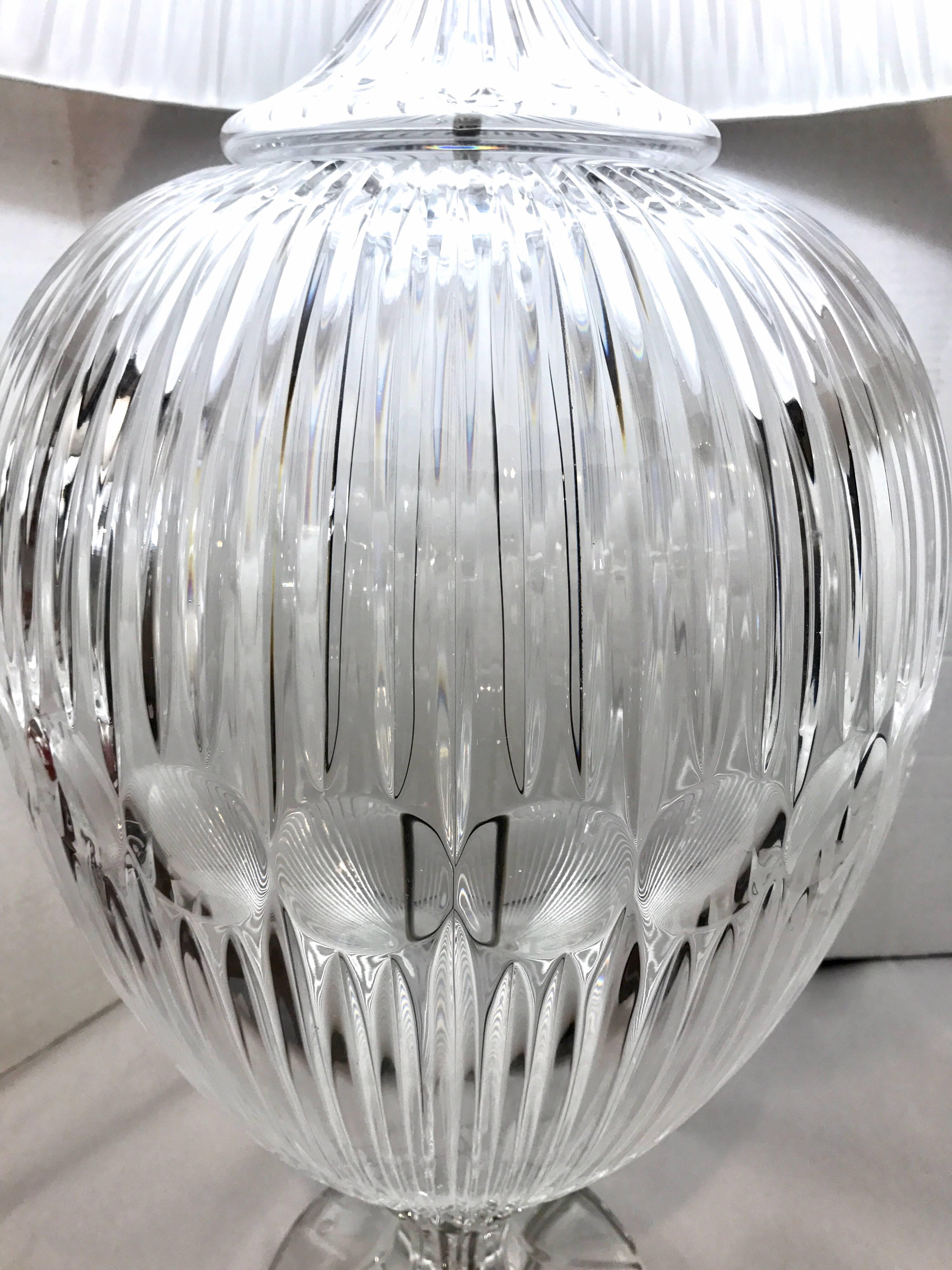 Stunning pair of heavy Italian crystal lamps. Pleated silk shades included and measure 14 inches wide x 39 inches high. What sets these lamps apart are their scale and gorgeous craftsmanship.