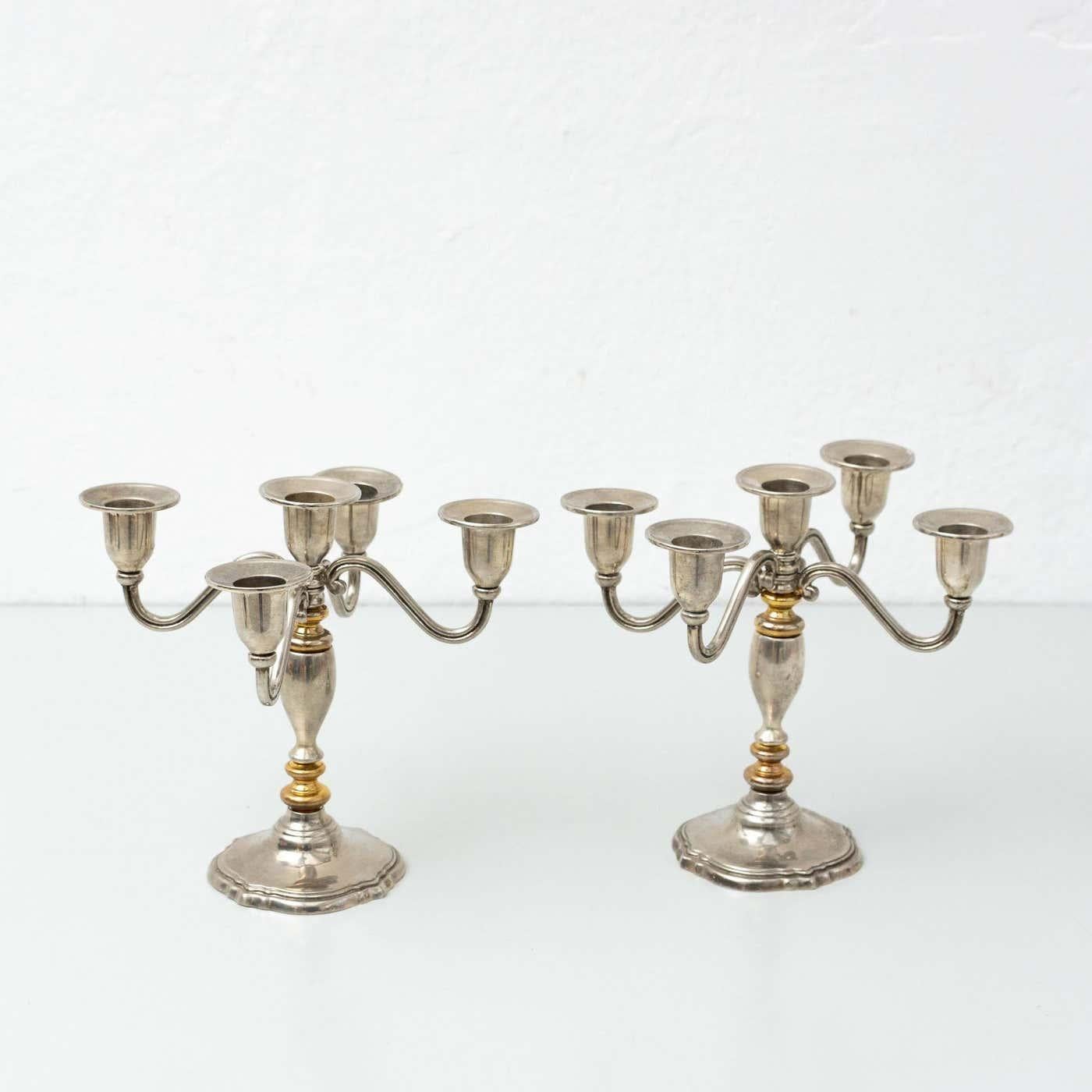 Set of two antique candlestick.
By unknown manufacturer from France, circa 1950.

In original condition, with minor wear consistent with age and use, preserving a beautiful patina.

Materials:
Metal

Dimensions (each one):
D 22.2 cm x W 22.7 cm x H