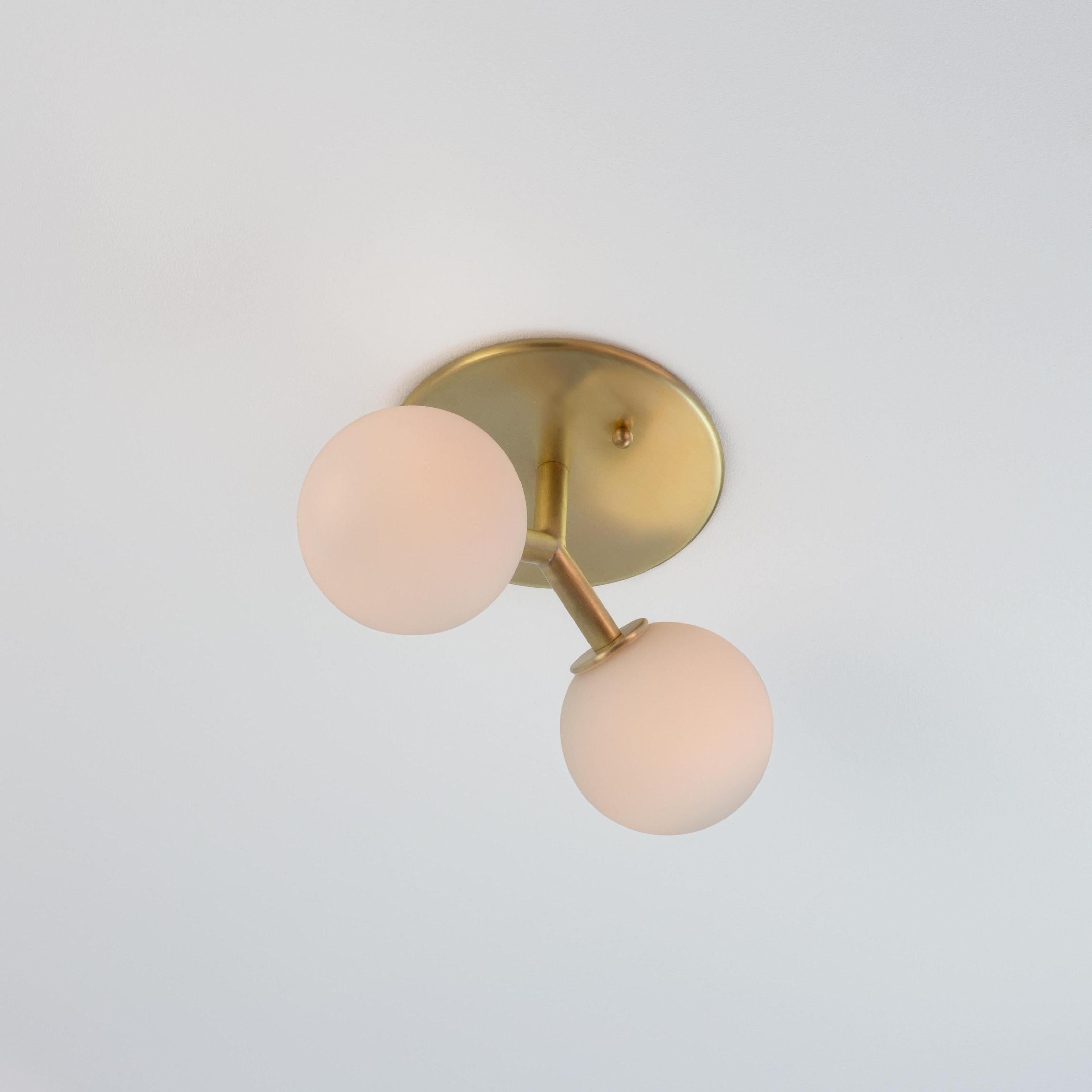 This listing is for 2x Y Flush Mount in Brass designed and manufactured by Research Lighting.

Materials: Brass & Glass
Finish: Raw Brushed Brass 
Electronics (per fixture): 2x G9 Sockets, 2x 2.5 Watt LED Bulbs (included), 500 Lumens total
UL