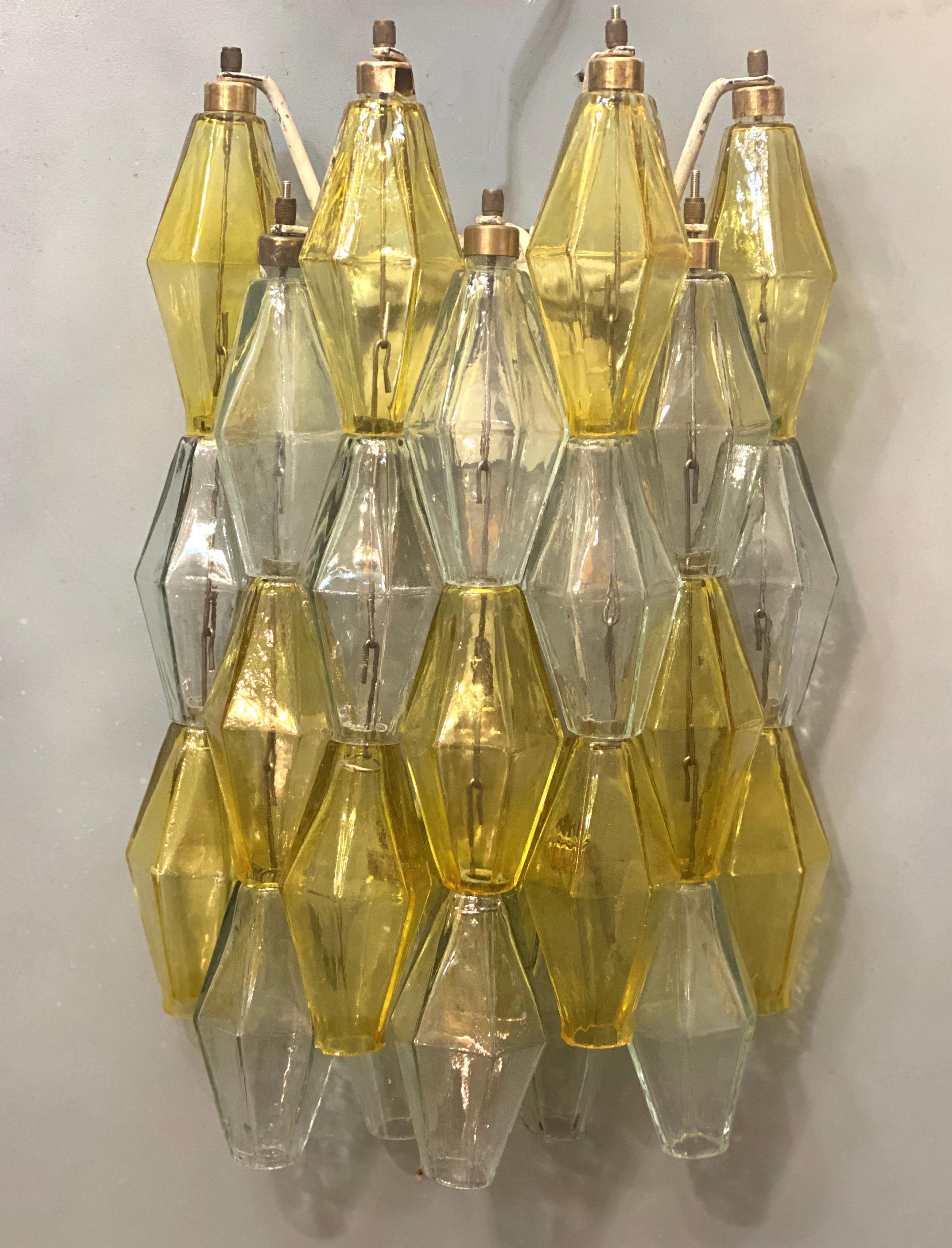 Amazing pair of poliedri wall lights. Rare combination of yellow amber and light blue color Murano glass.
Available four pairs and also a chandelier.
Provenance form a historic Roman Palace of the period.
This light fixture can be disassembled and