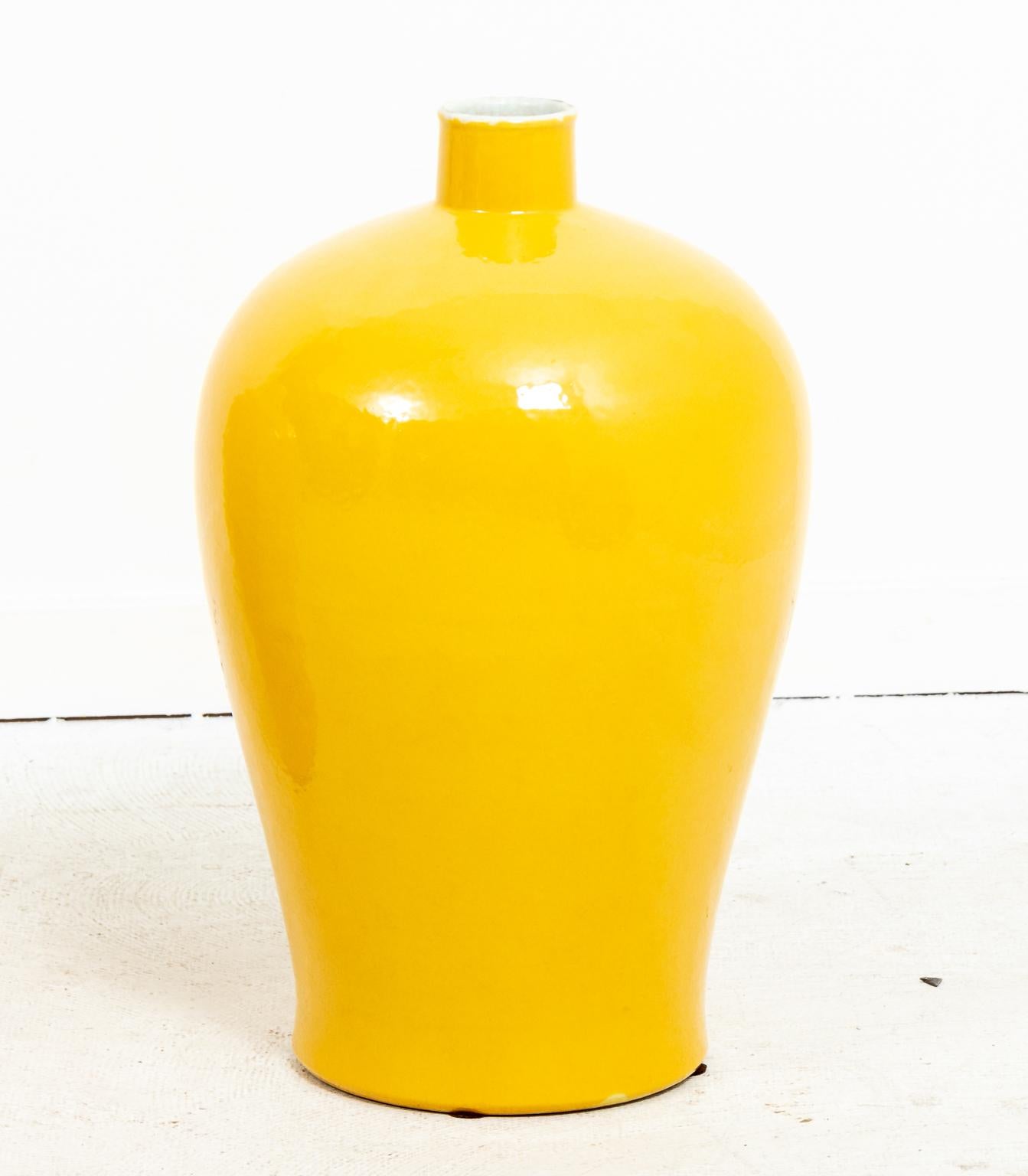 Pair of yellow painted bottle neck vases. Please note of wear consistent with age including discoloration.