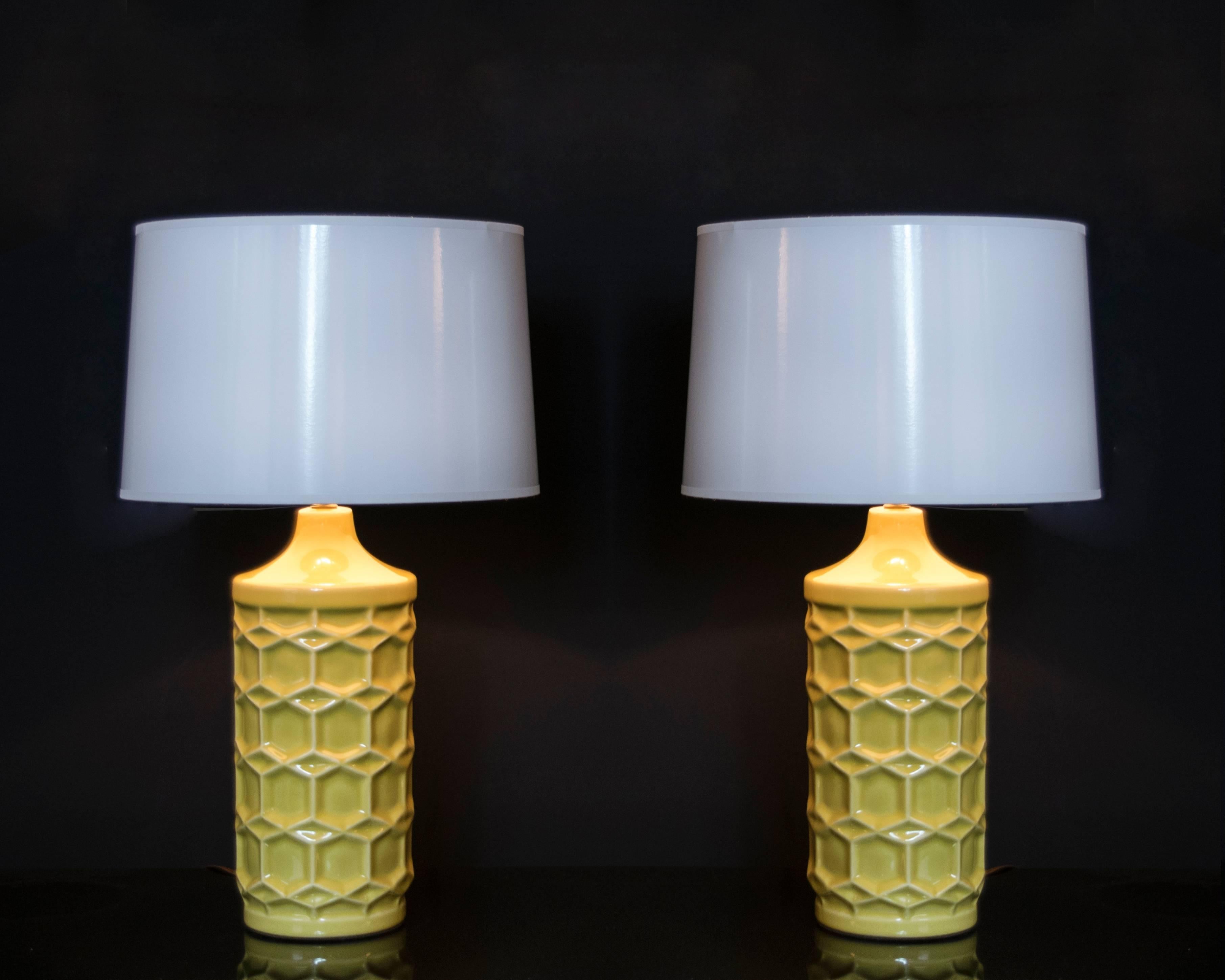 Wonderful pair of matte gold/yellow ceramic honeycomb lamps. These lamps are sure to add a bright spot of color to any room.
