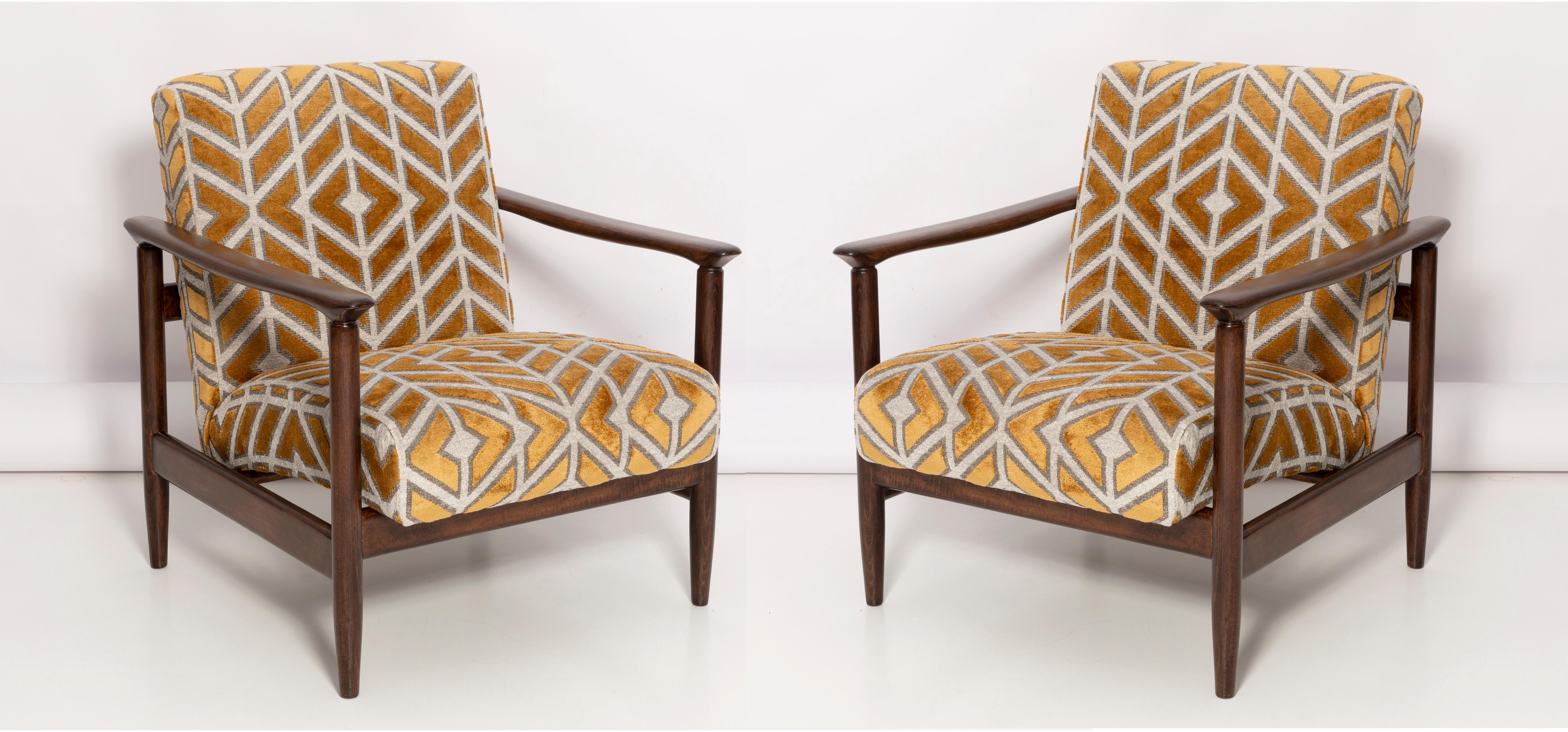 A pair of armchairs GFM-142, designed by Edmund Homa. The armchairs were made in the 1960s in the Gosciecinska Furniture Factory. They are made from solid beechwood. The GFM-142 armchair is regarded one of the best polish armchair design from the
