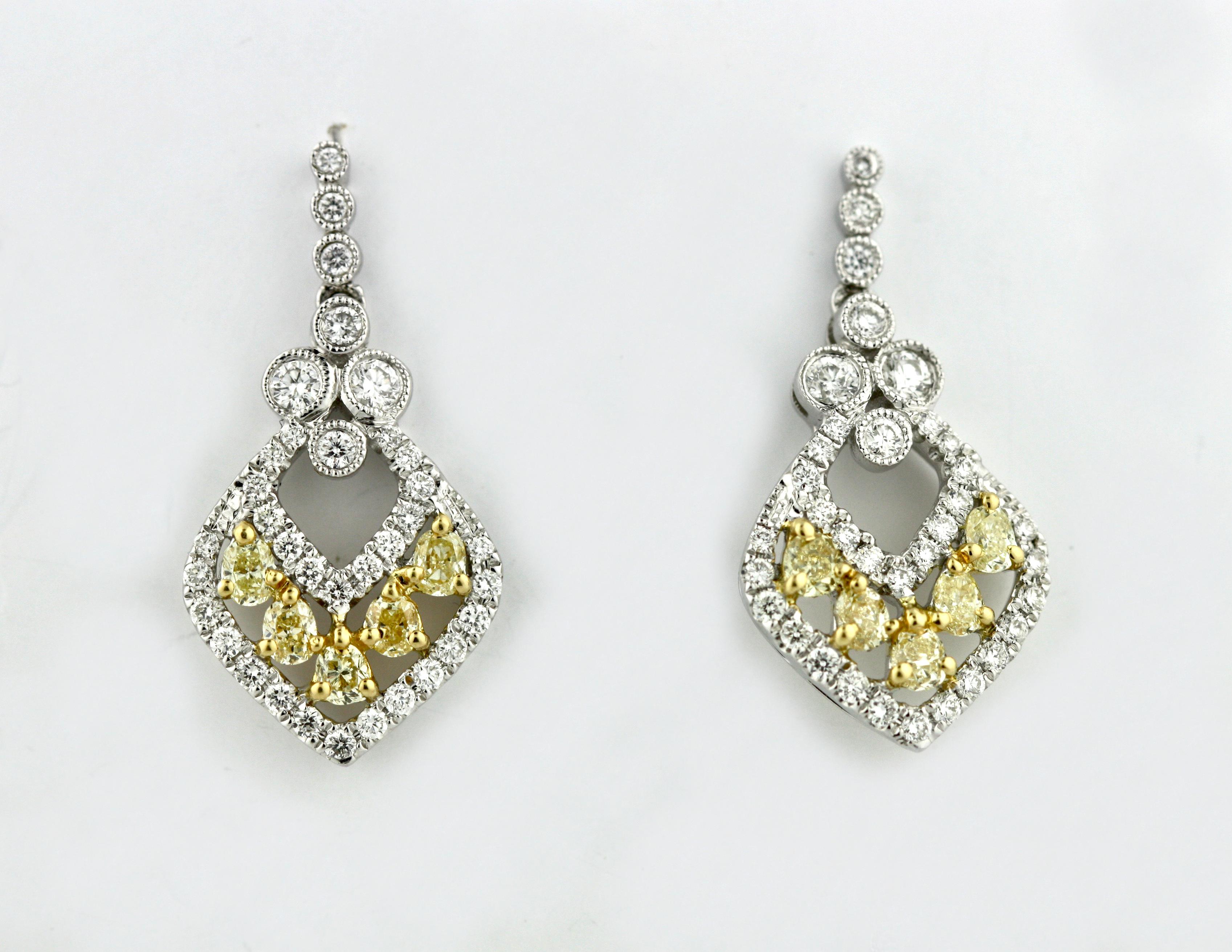 
Pair of Yellow Diamond and Diamond Earrings
Each set with diamonds, post fittings, diamonds weighing a total of approximately 1.59 carats, mounted in 18 karat white gold