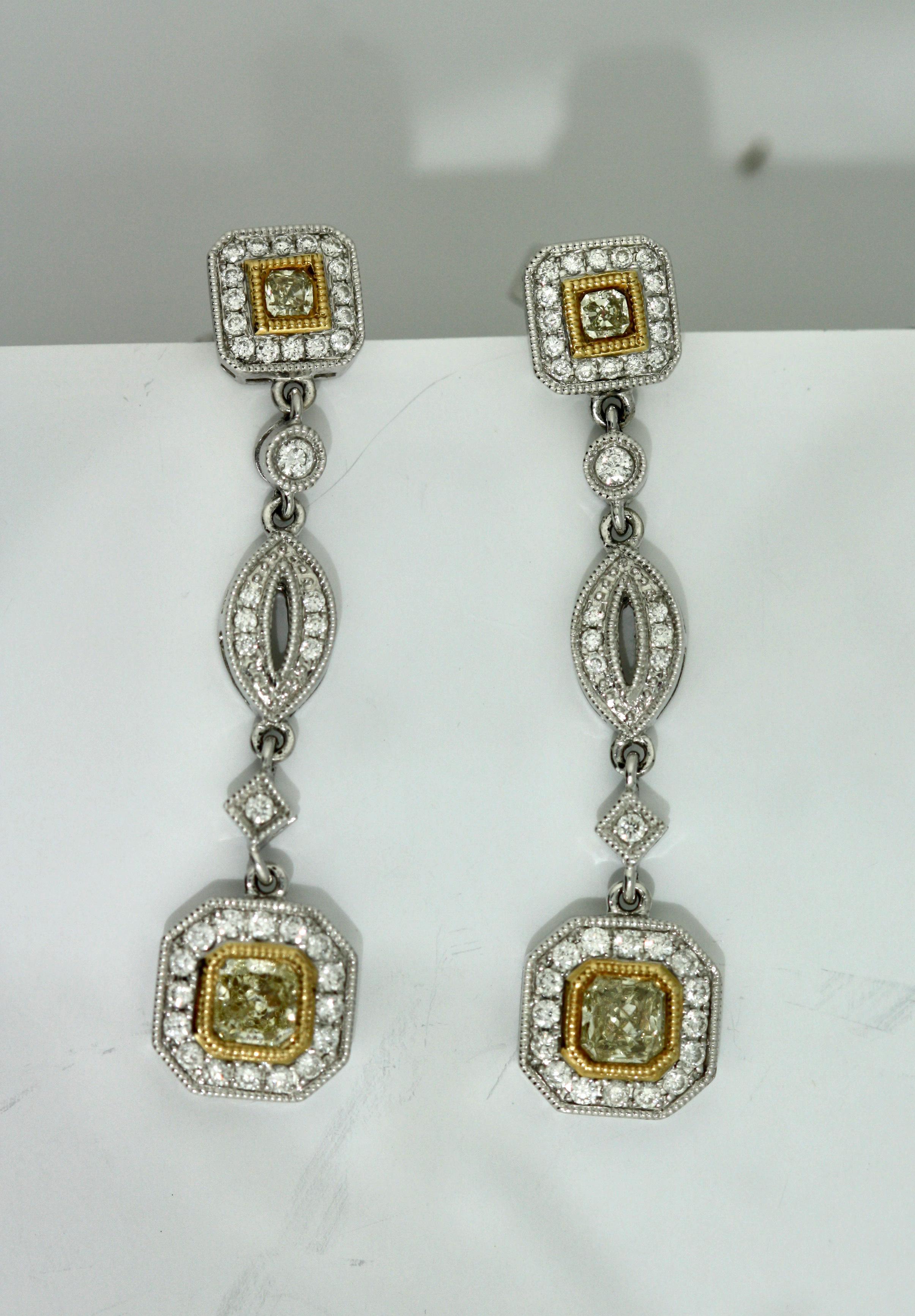 Pair of Yellow Diamond and Diamond Earrings
Each set with diamonds, post fittings, diamonds weighing a total of approximately 1.18 carats mounted in 18 karat white gold