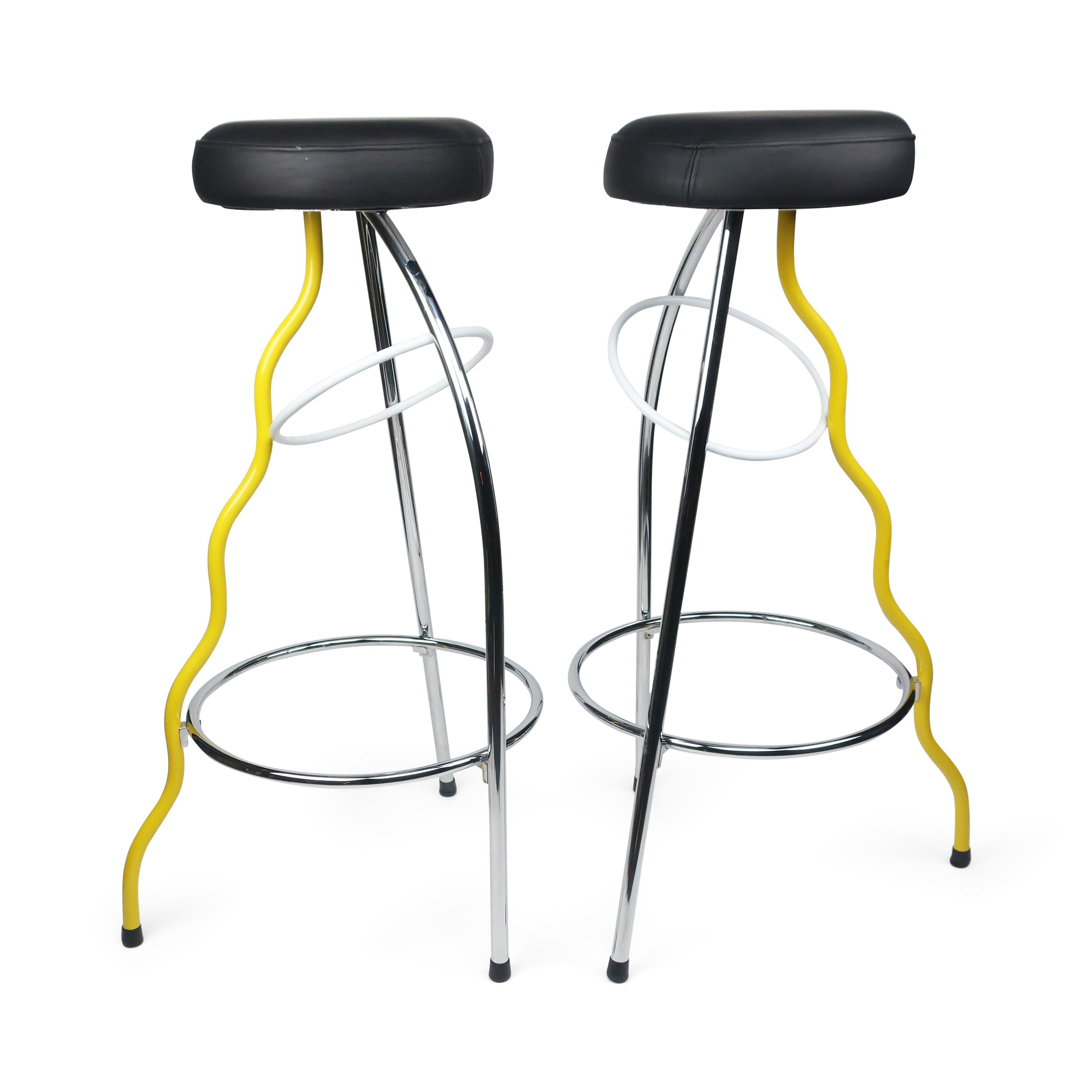 A near mint pair of yellow bar stools designed by Javier Mariscal for Bar Dúplex in Valencia in 1980. The Duplex bar stool is an iconic example of 1980s and postmodern design and was produced by B. D. Ediciones de Diseno, Barcelona. Three steel legs