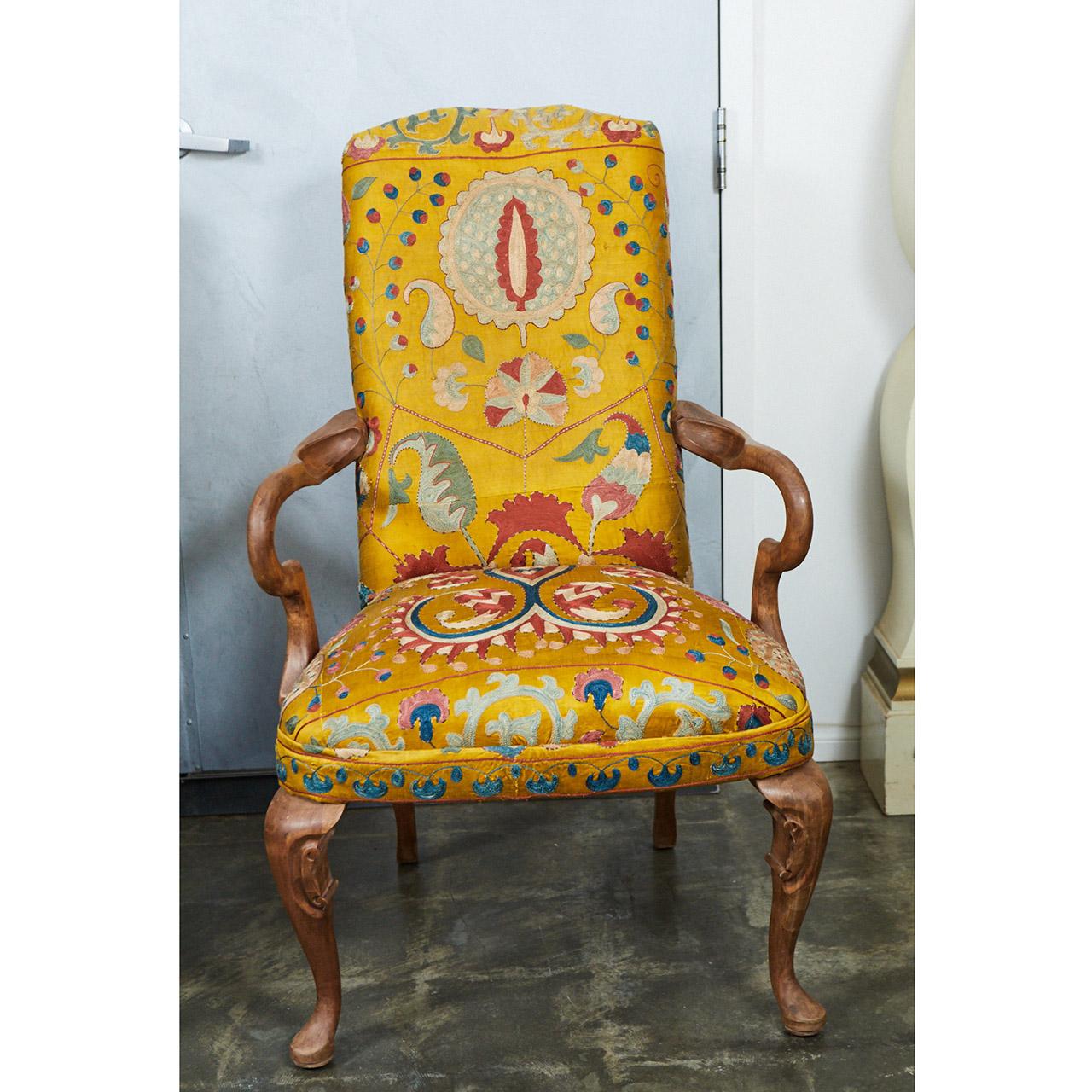 These exceptional Queen Ann style chairs have been upholstered with gorgeous embroidered golden yellow silk fabric. The frames are made from carved birchwood with delicate details. From the condition and craftsmanship we believe they were made in
