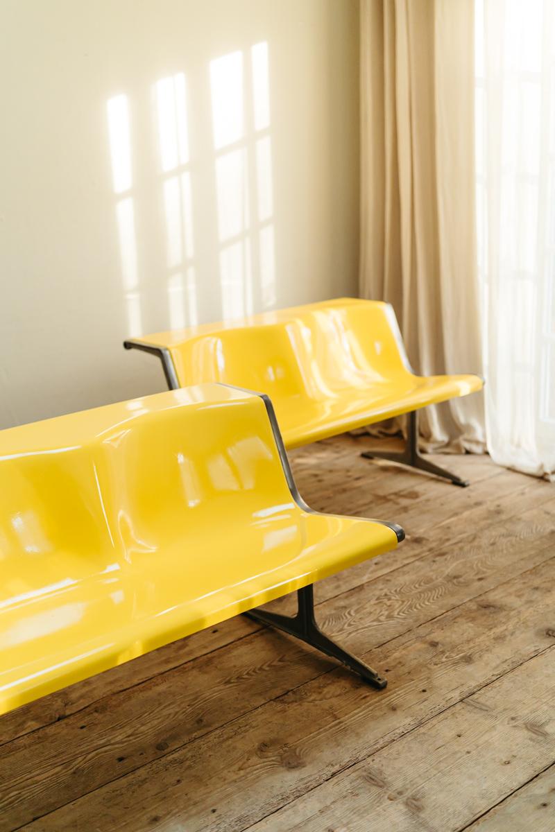 Friso Kramer designed these 1200 series two-seat in 1967 for Wilkhahn Germany, which became one of Wilkhahn's most iconic products. These vibrant yellow colored funky benches are in very good vintage condition.