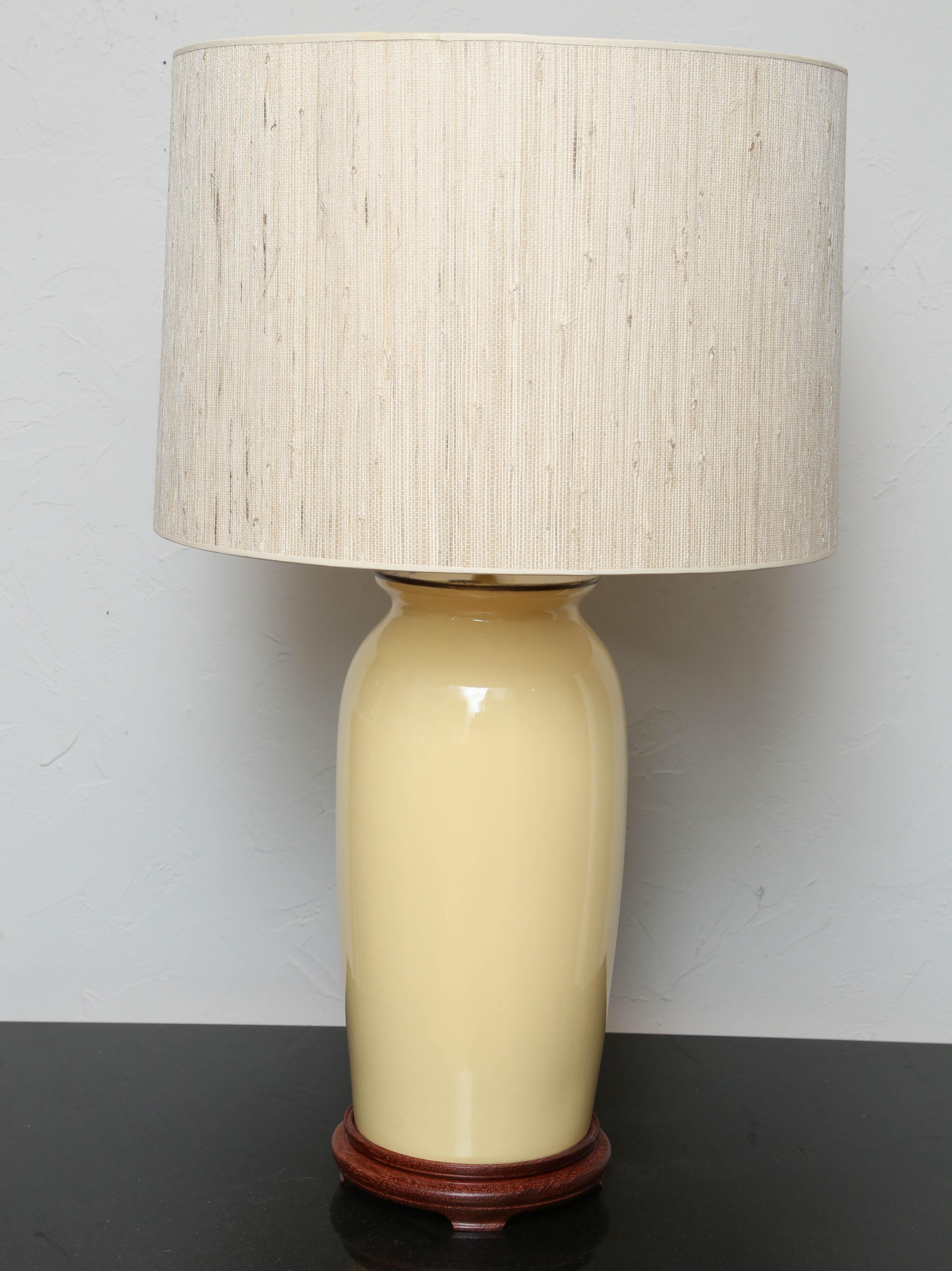 Vintage pair of pale yellow ginger jar lamps with new bamboo shades.