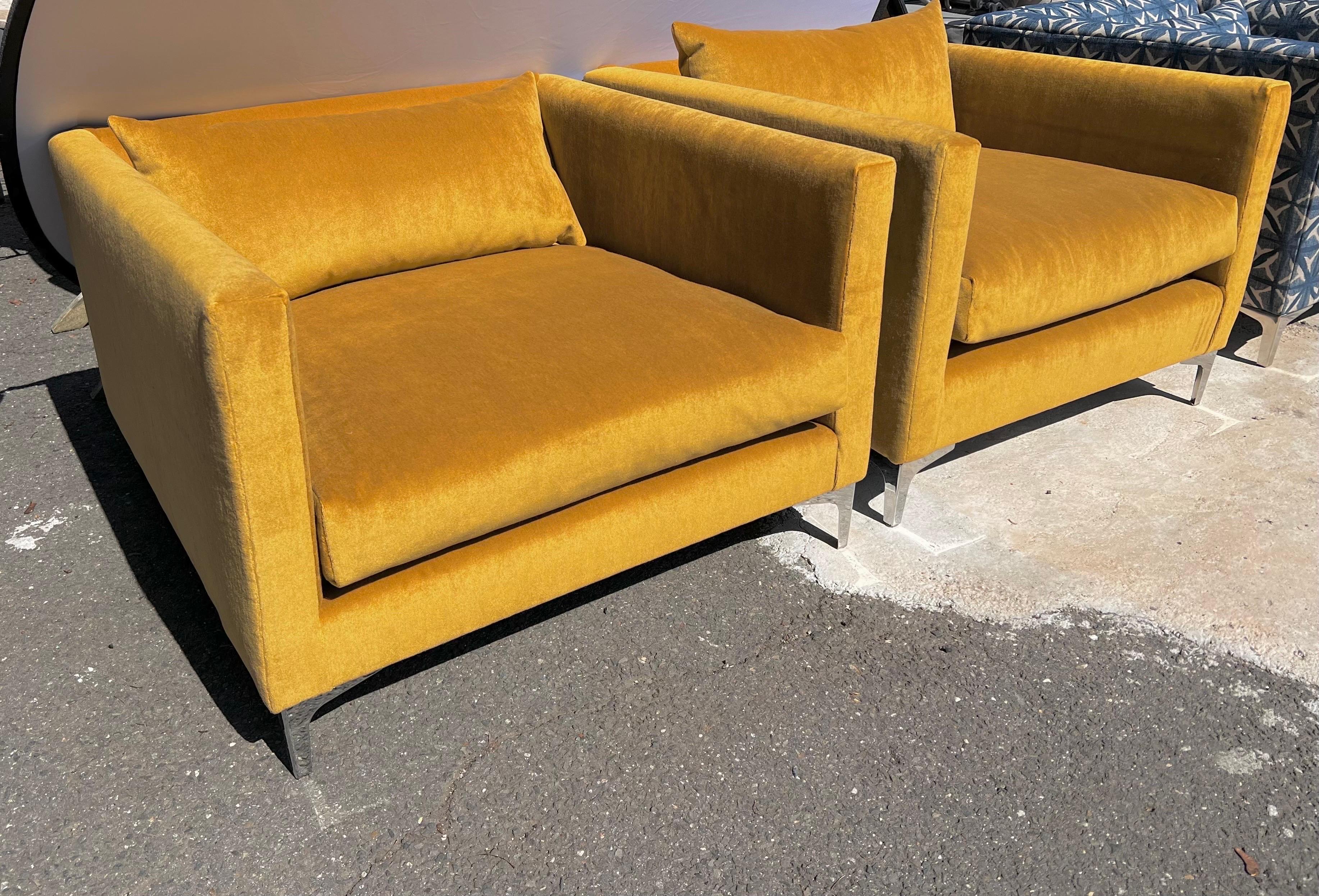 Pair of mid century style matching oversized cube chairs newly upholstered in a yellow gold mohair fabric supported on a chrome base. 