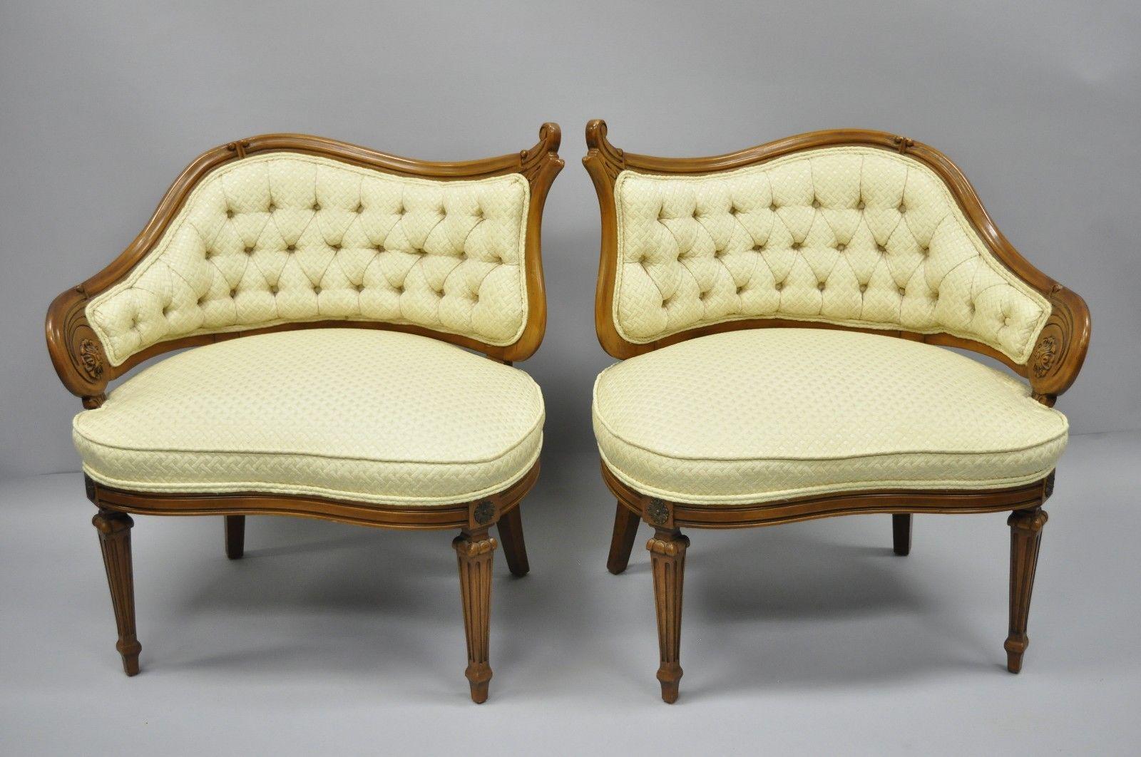 Pair of vintage yellow Hollywood Regency French style wingback lounge parlor chairs. Item features right and left wings, yellow upholstery, metal leg ormolu, solid wood construction, tapered legs, quality American craftsmanship, and great style and