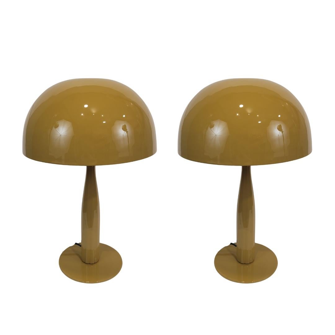 Excellent pair of side or table lamps, made of metal in France, in the shape of a mushroom, an icon of 20th-century design. Simple structure, an austere shaft supports a hemispherical or mushroom-shaped shade. The base is also composed of a simple