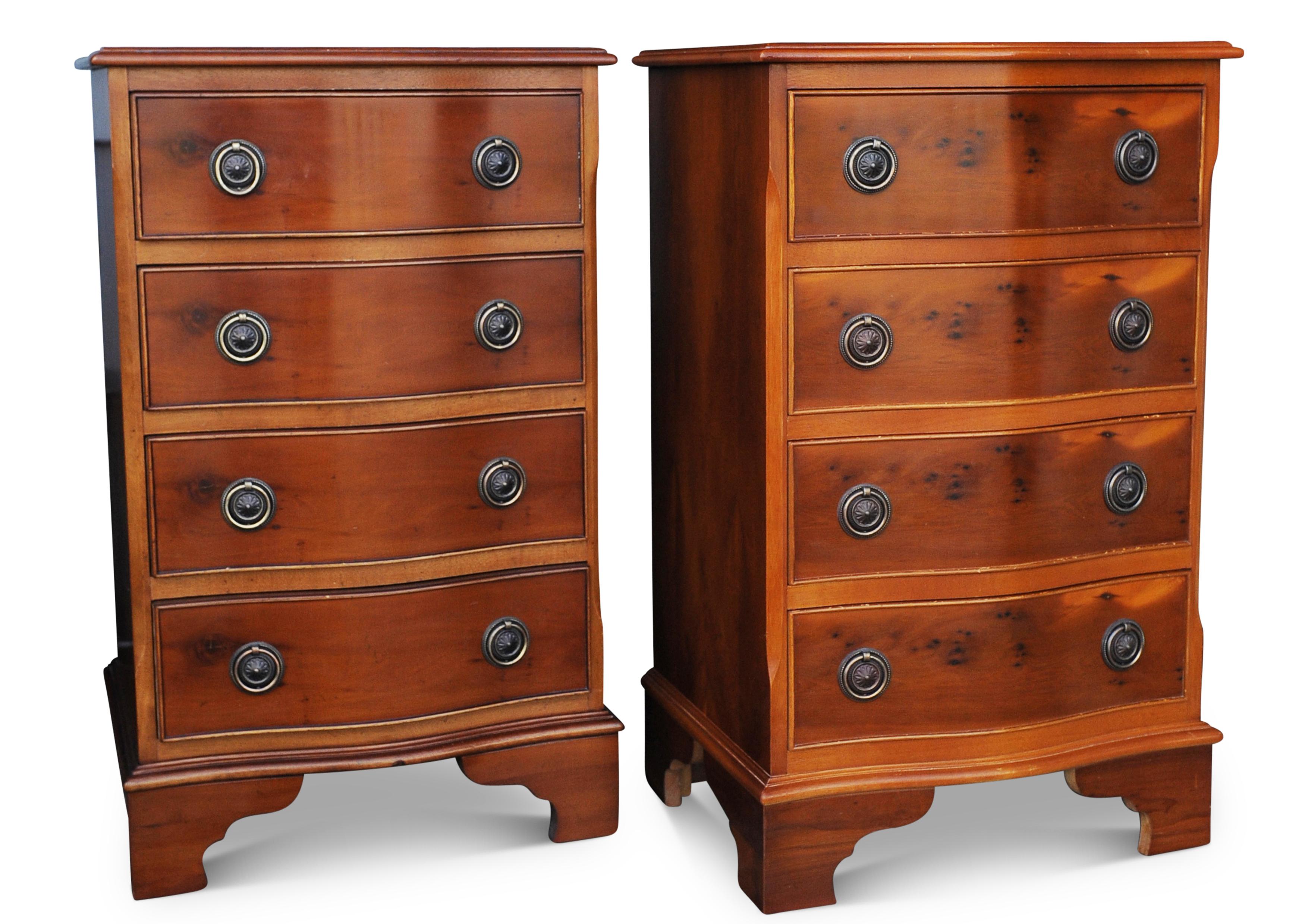 Pair of Yew wood serpentine front four drawer bedside cabinets

.