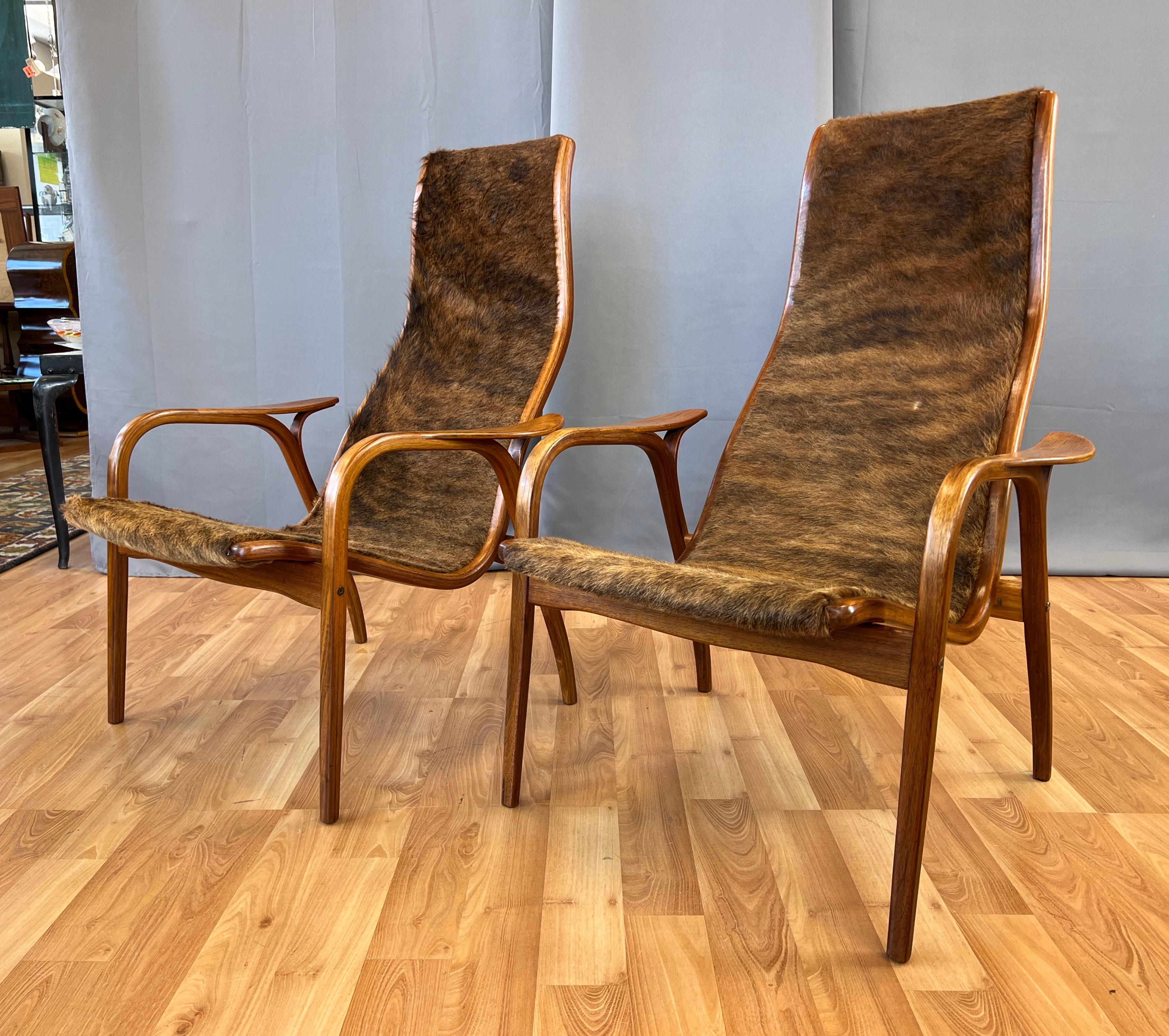 Swedish Pair of Yngve Ekström Lamino Teak with Cowhide Lounge Chairs for Swedese, 1950s