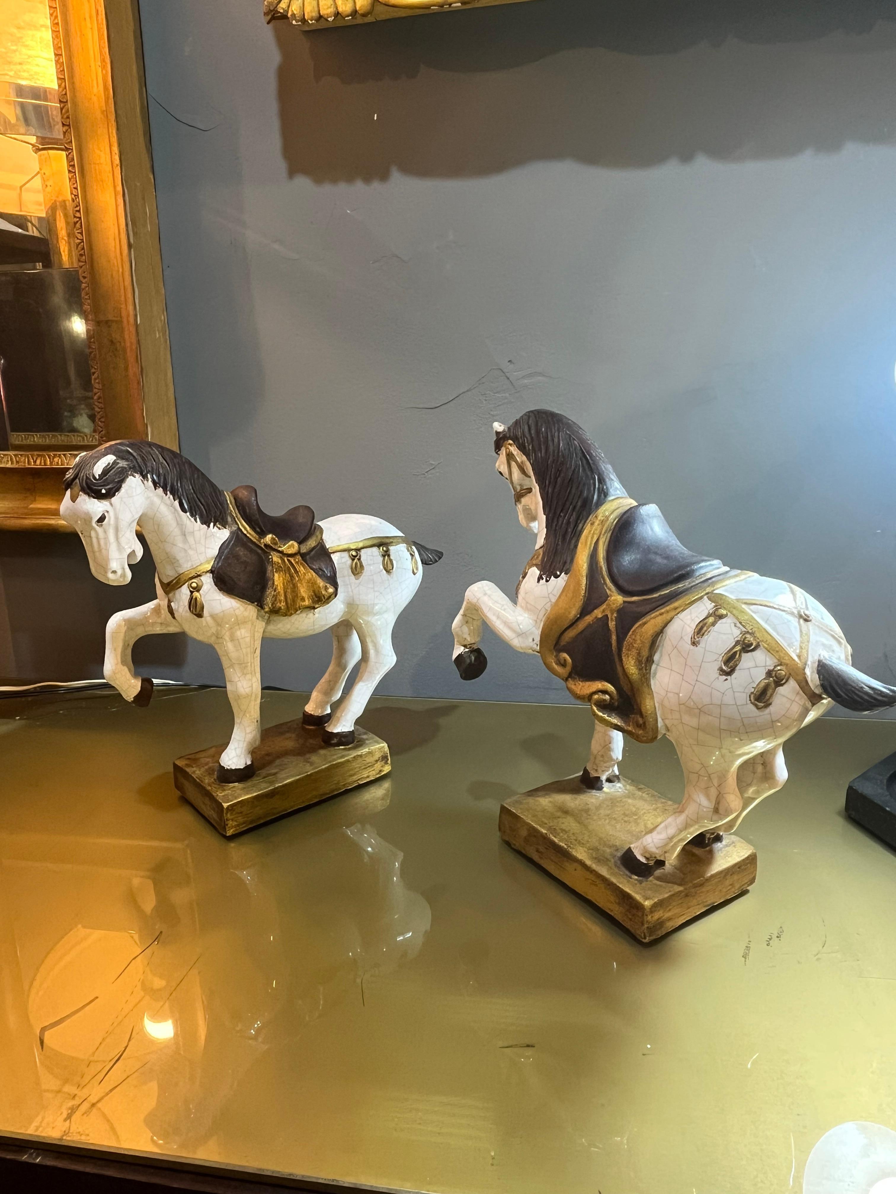 pair of Zaccagnini prancing horses in enameled terracotta from the 60s. Products in good condition with small wear caused by the years and use. Please carefully view the attached images.