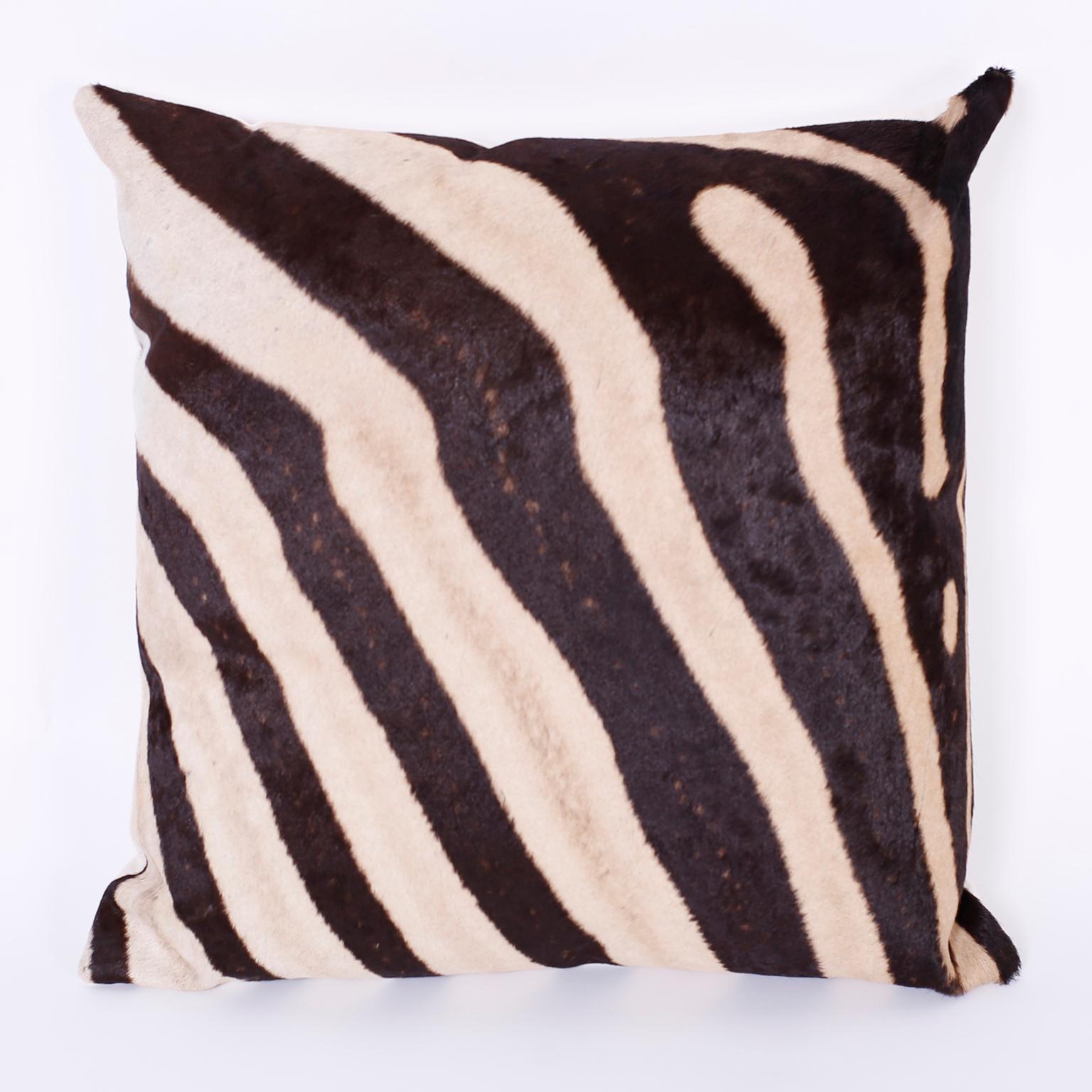 Pair of zebra hide pillows with linen backs and discreet zippers in a seam. Priced individually.