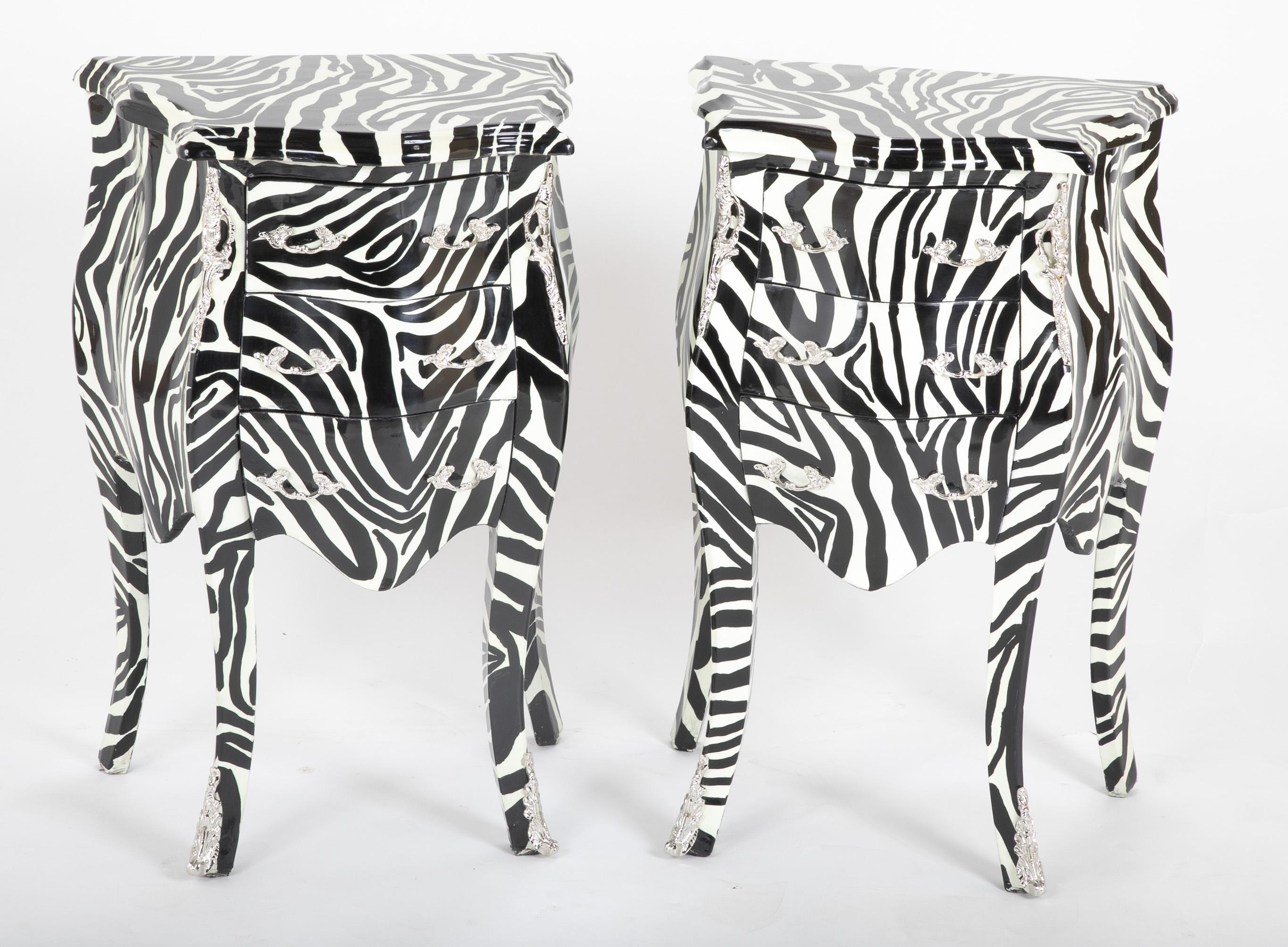 A fun pair of zebra painted Louis XIV style commodes having silvered brass mounts. Painted in high gloss paint.